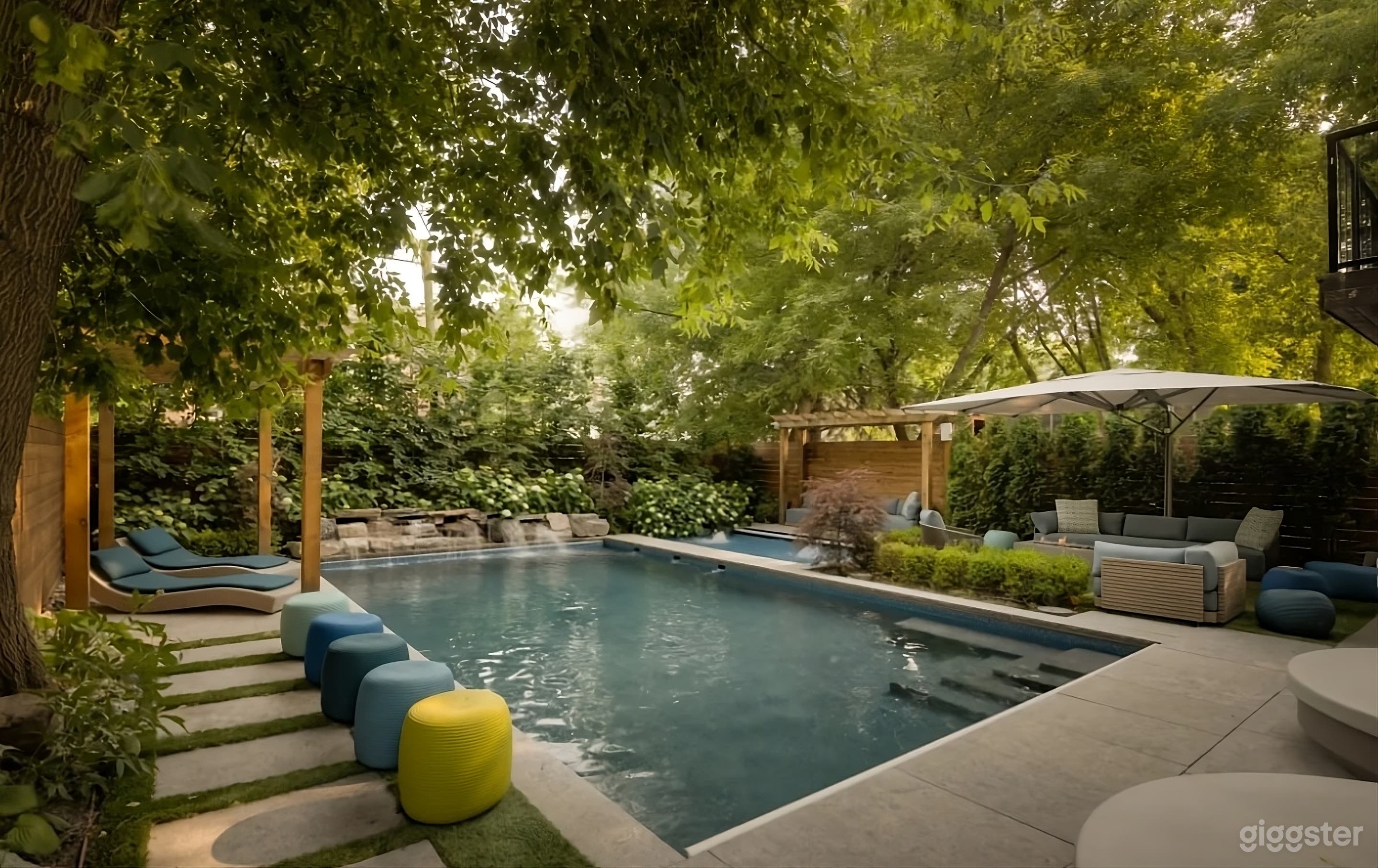 Secluded Backyard with Waterfall Pool Photo 2
