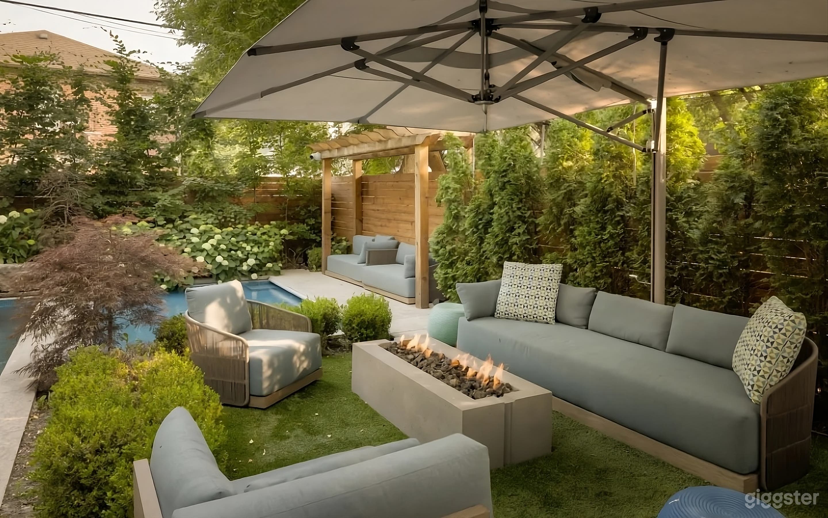 Secluded Backyard with Waterfall Pool Photo 1