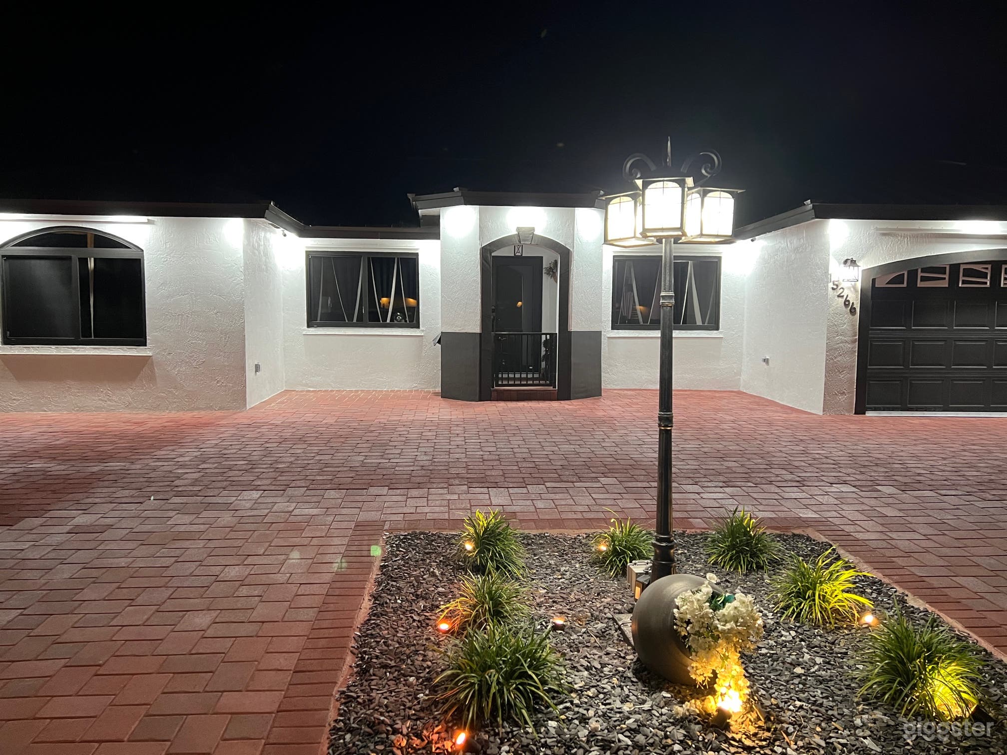 Front view of house at night.