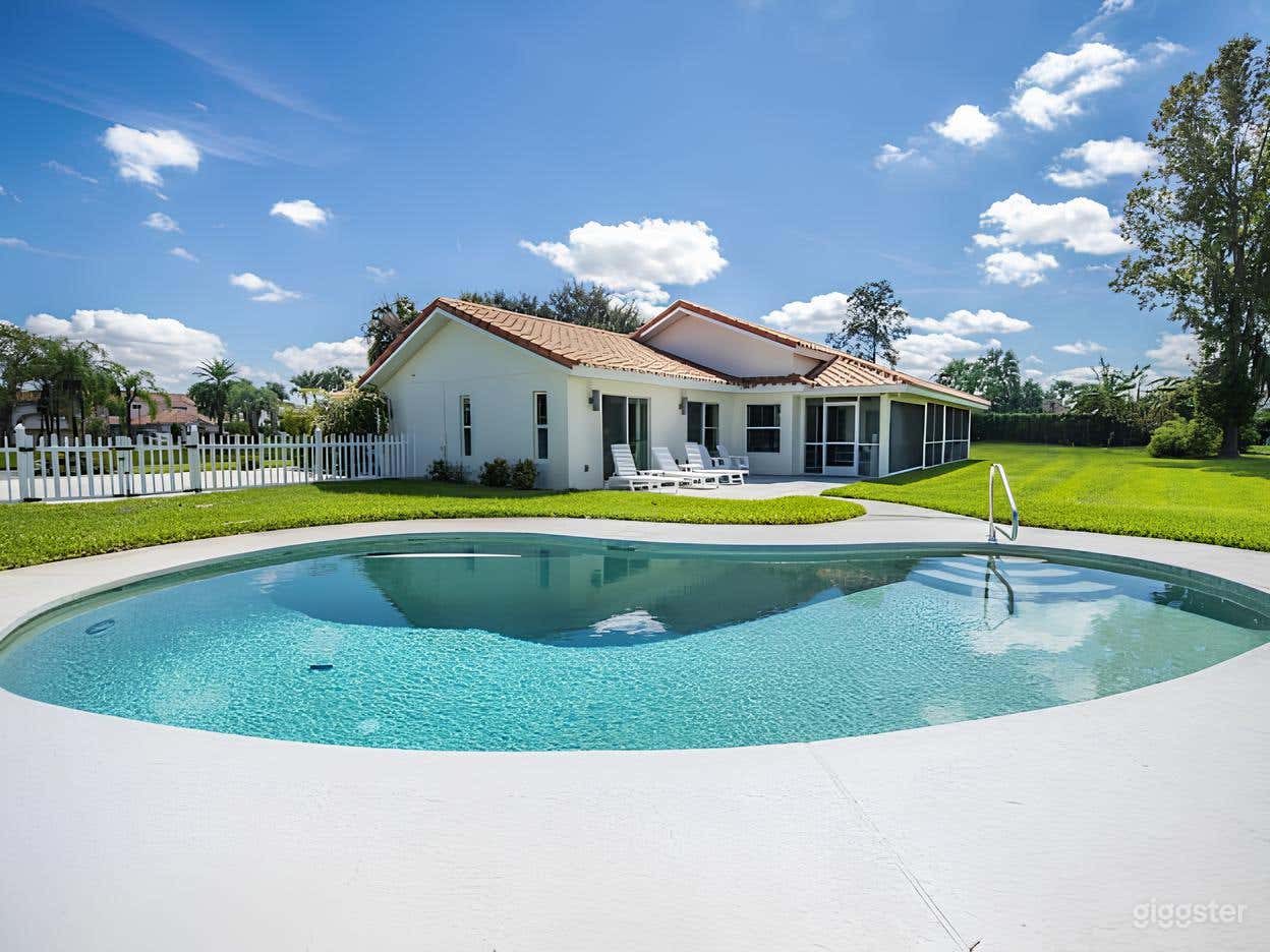 Bright White Backyard & Oval Pool Photo 1