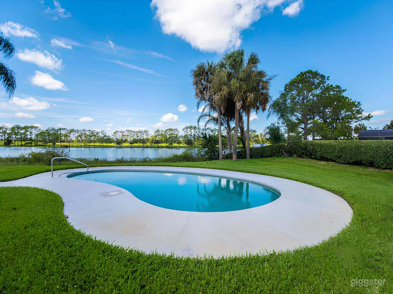 Bright White Backyard & Oval Pool Photo 3