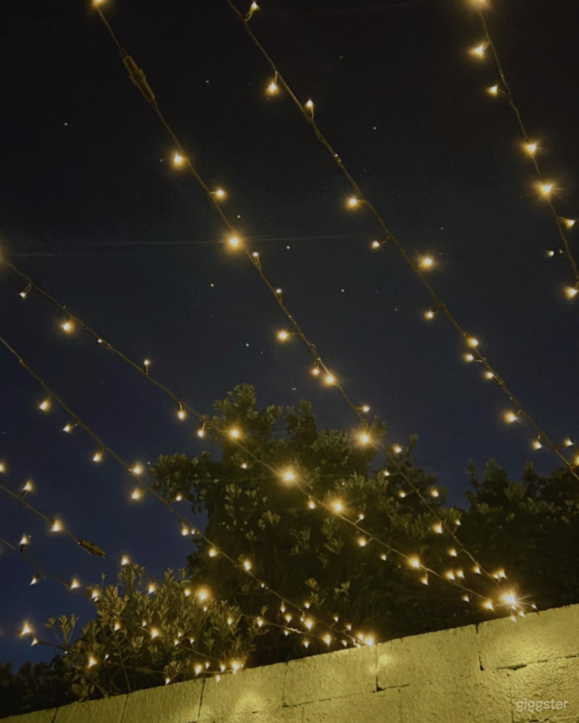 Fairy lights in courtyard set the scene for evening events.