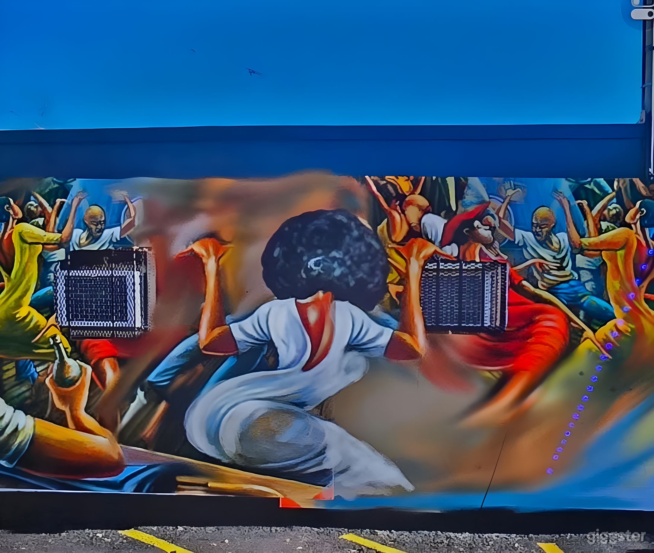 Vibrant Courtyard with Mural Walls Photo 3