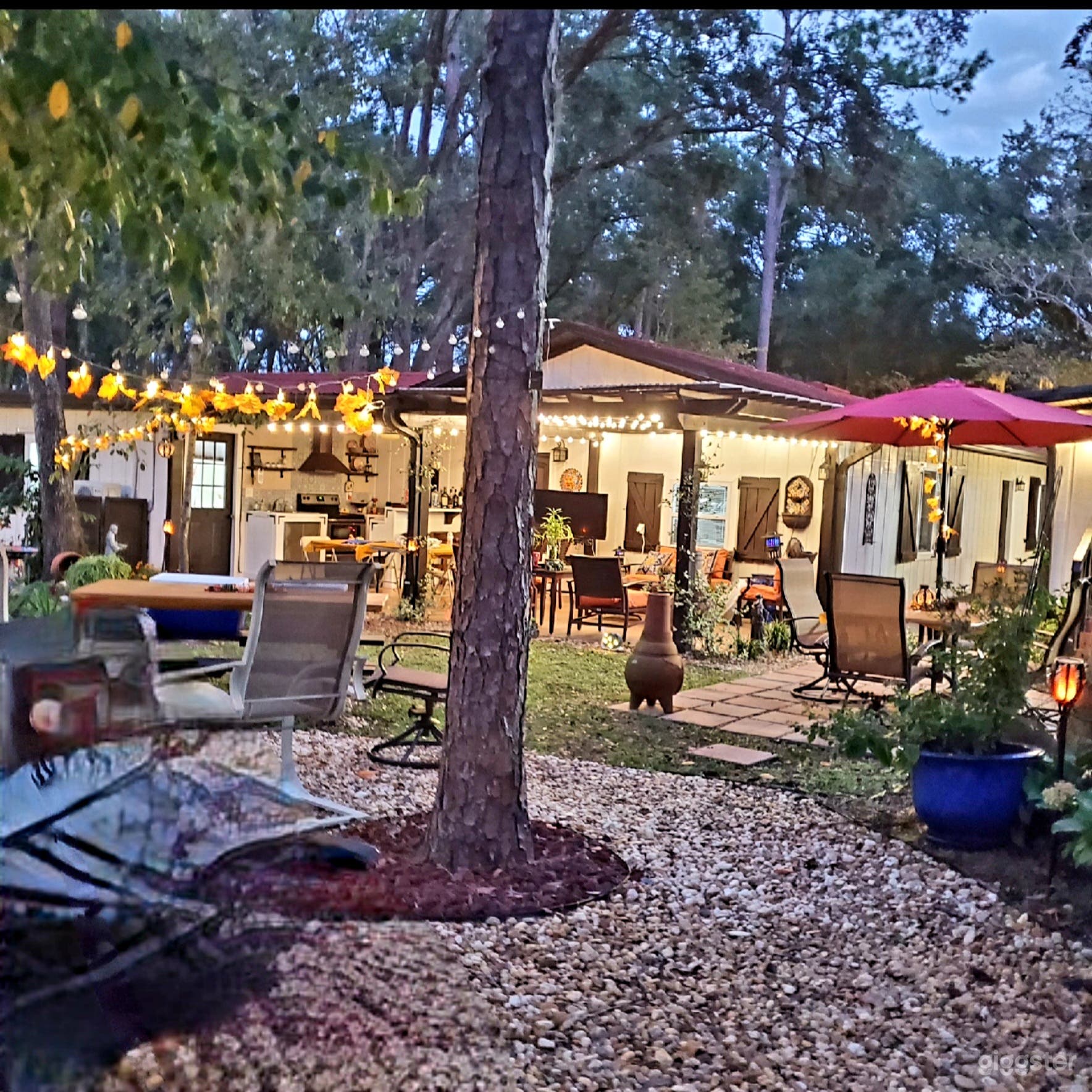 Outside kitchen. Pergola, Artist studio, and other sitting areas.