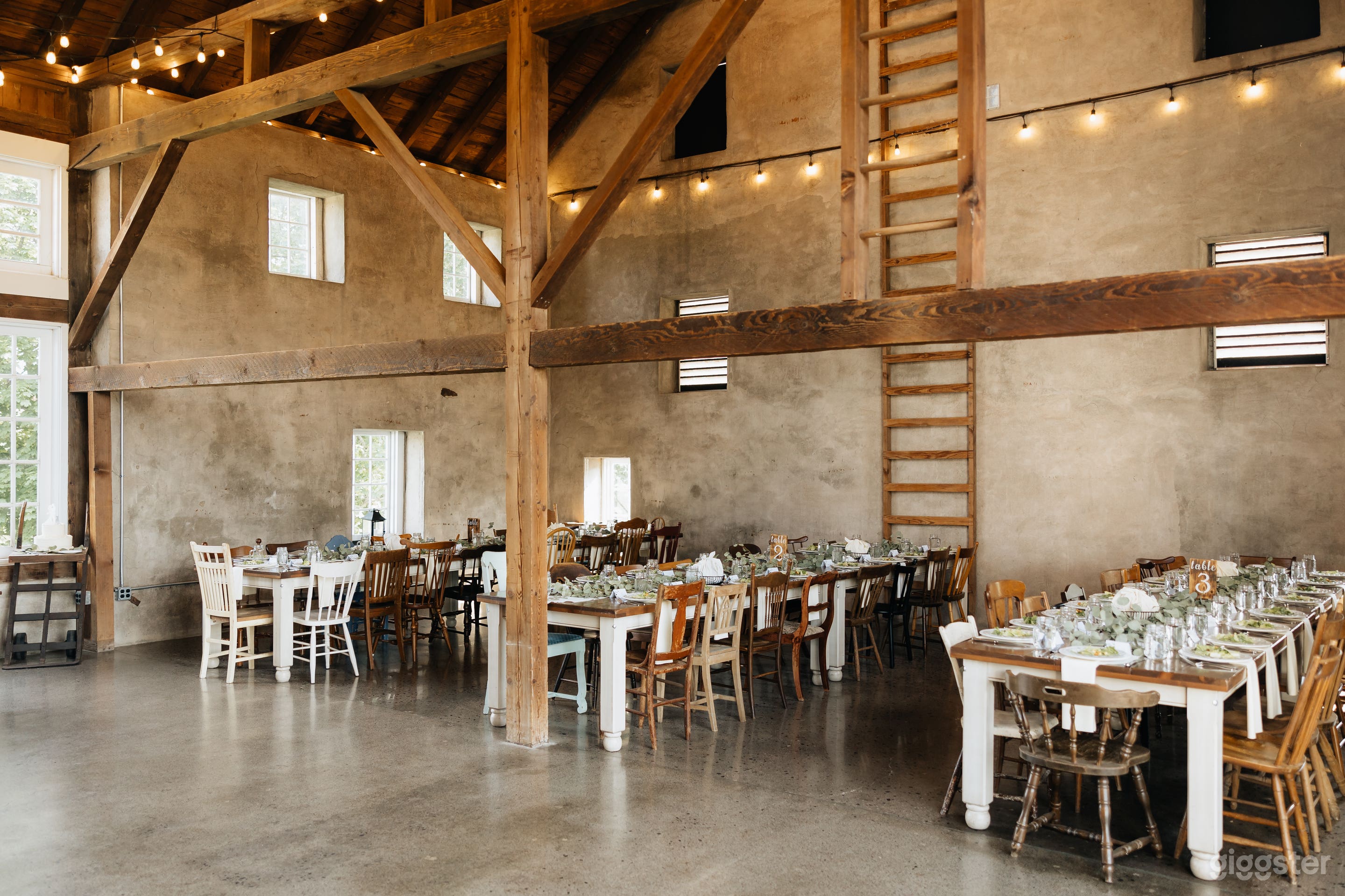 Inside of stone bank barn; concrete walls and floor with exposed beams! 