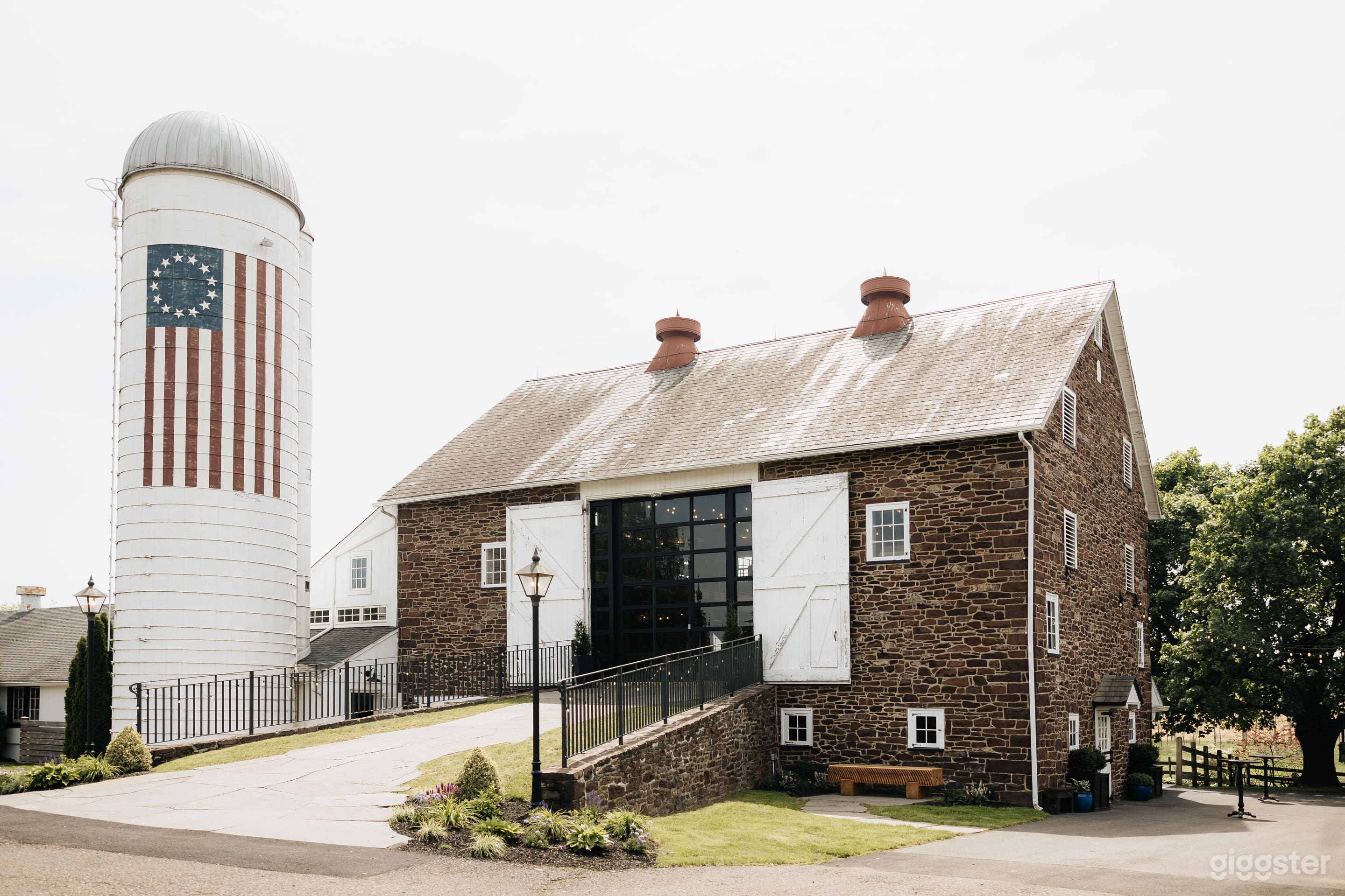 Front side of the stone bank barn as you enter the property