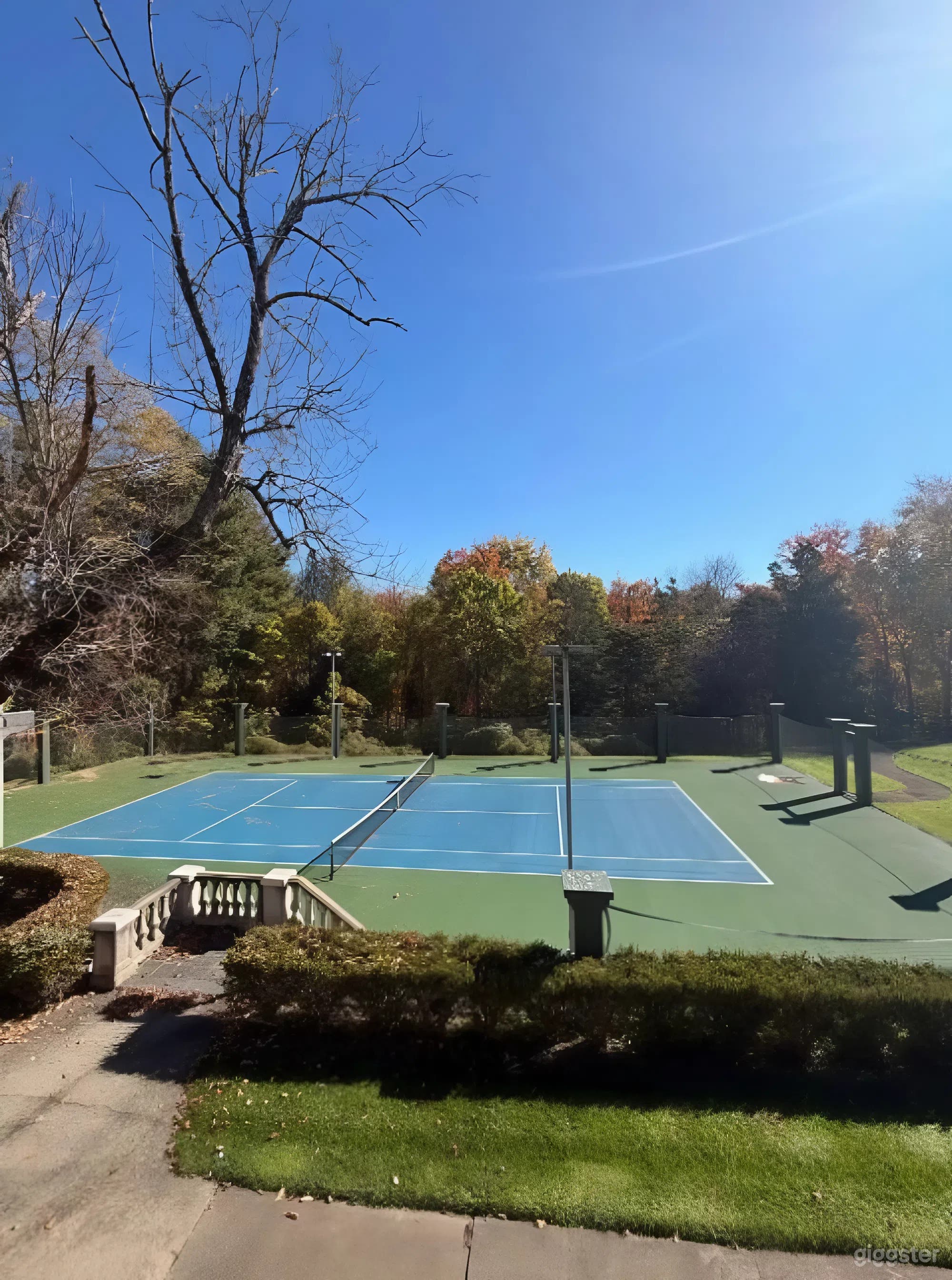 Outdoor Regulation-Size Tennis Court at a Luxury Estate Photo 2