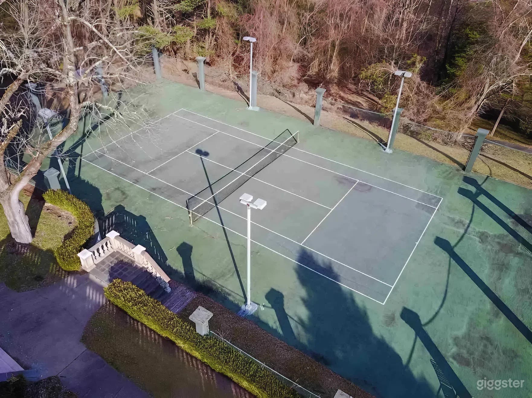 Outdoor Regulation-Size Tennis Court at a Luxury Estate Photo 4