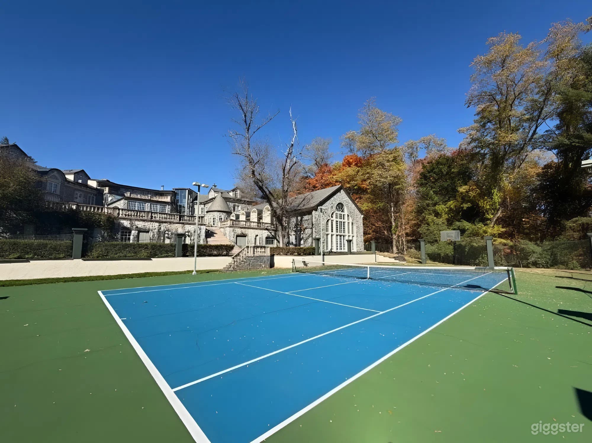 Outdoor Regulation-Size Tennis Court at a Luxury Estate Photo 3