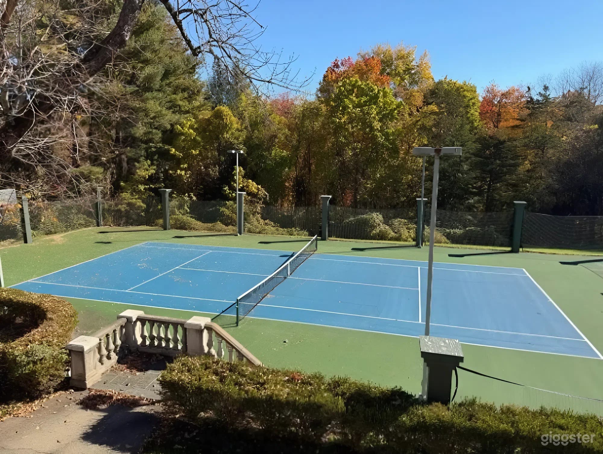 Outdoor Regulation-Size Tennis Court at a Luxury Estate Photo 1