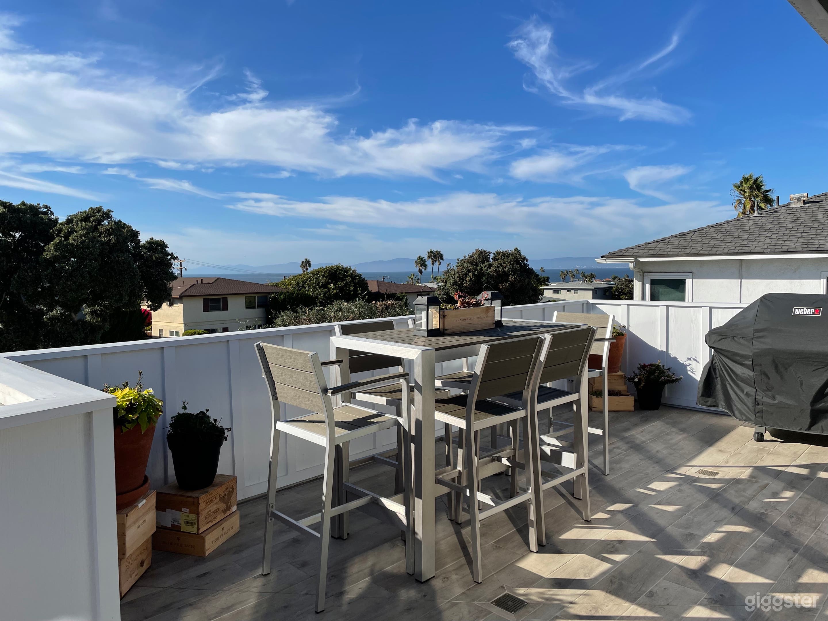 Patio outside living area with bbq, table and chairs. Ocean and Palos Verdes views.