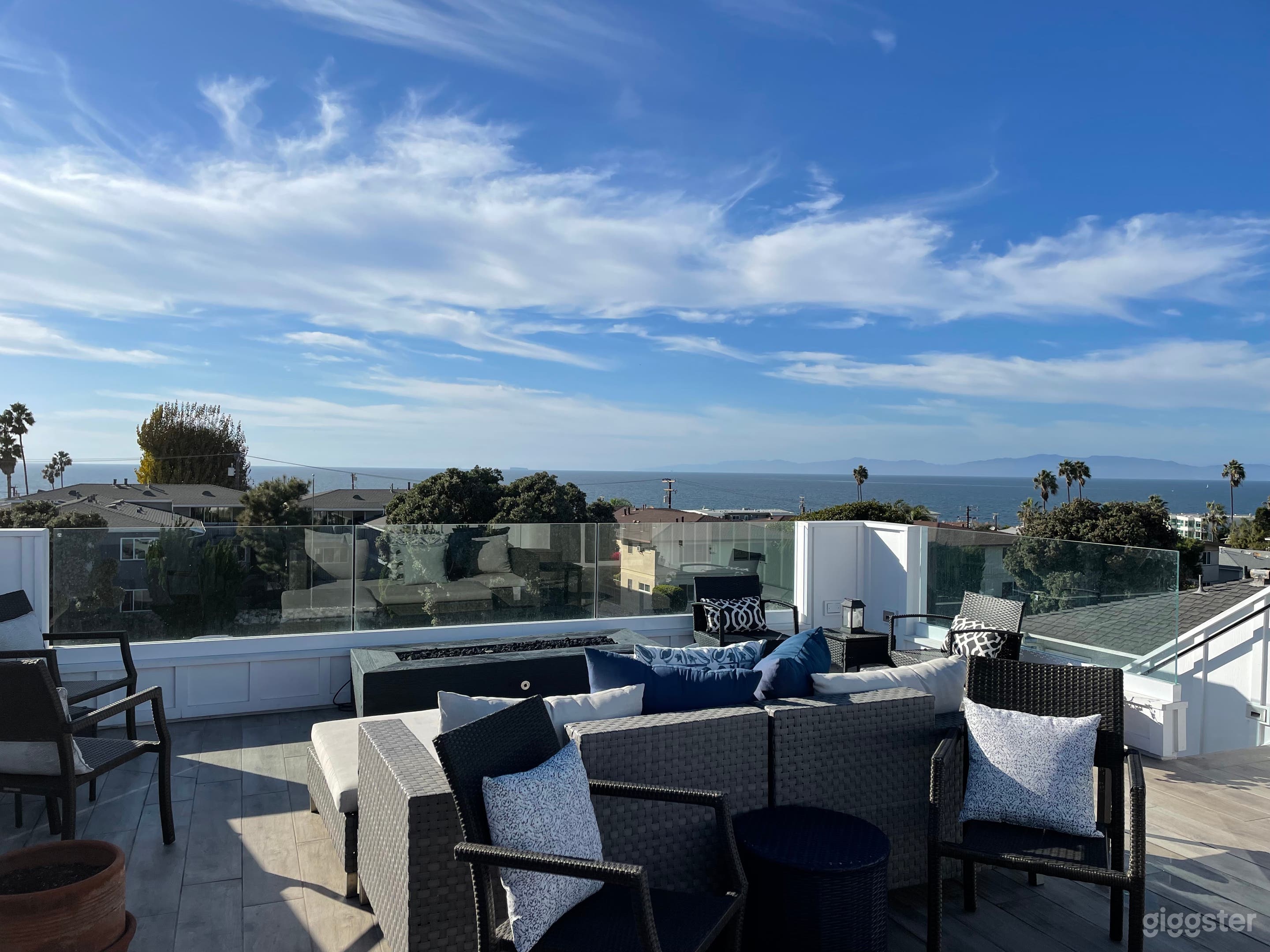 Roof Deck with sofa, chairs tables and fire pit. Beautiful views.