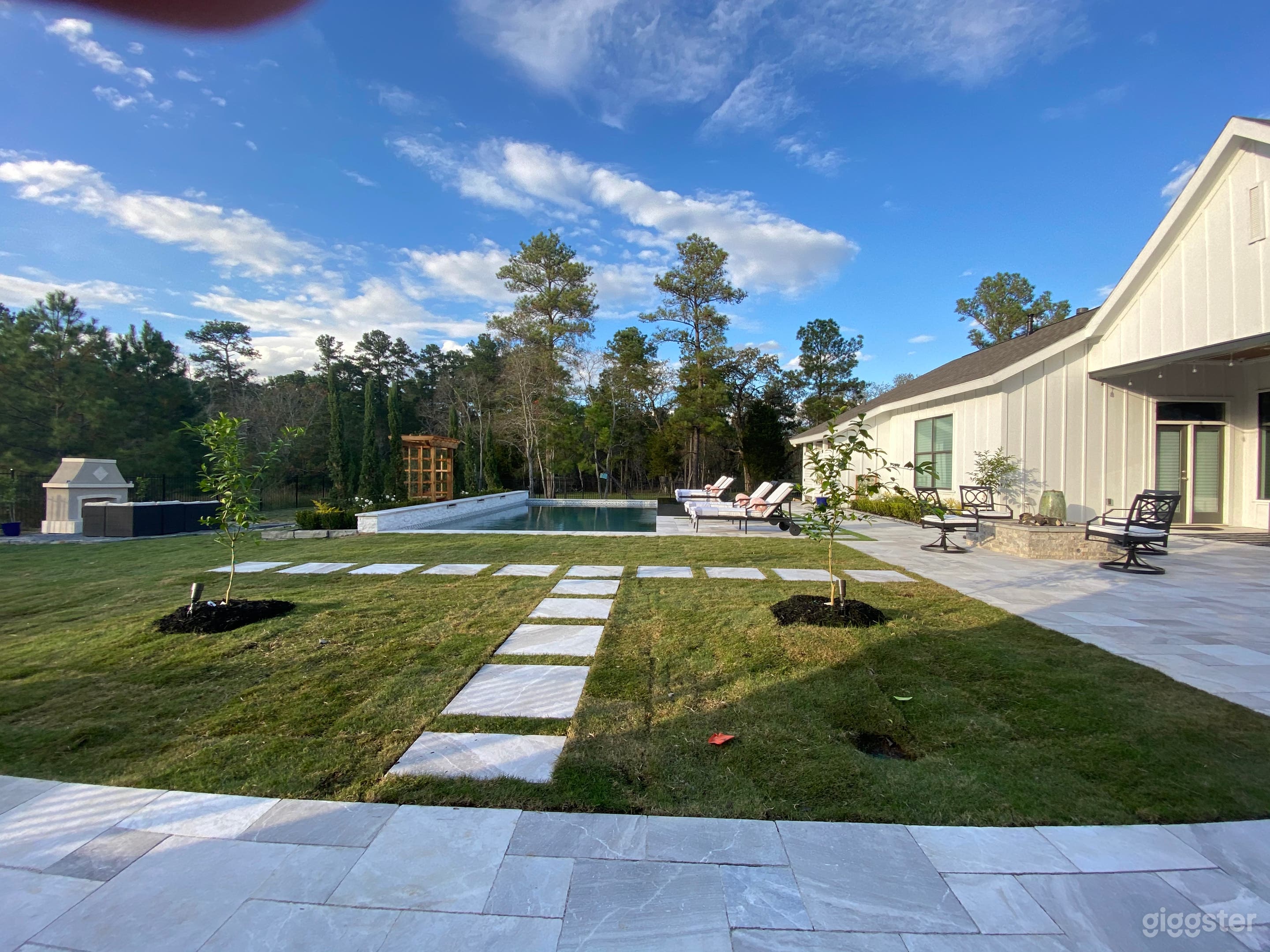 Pool area with L-shaped covered porch 