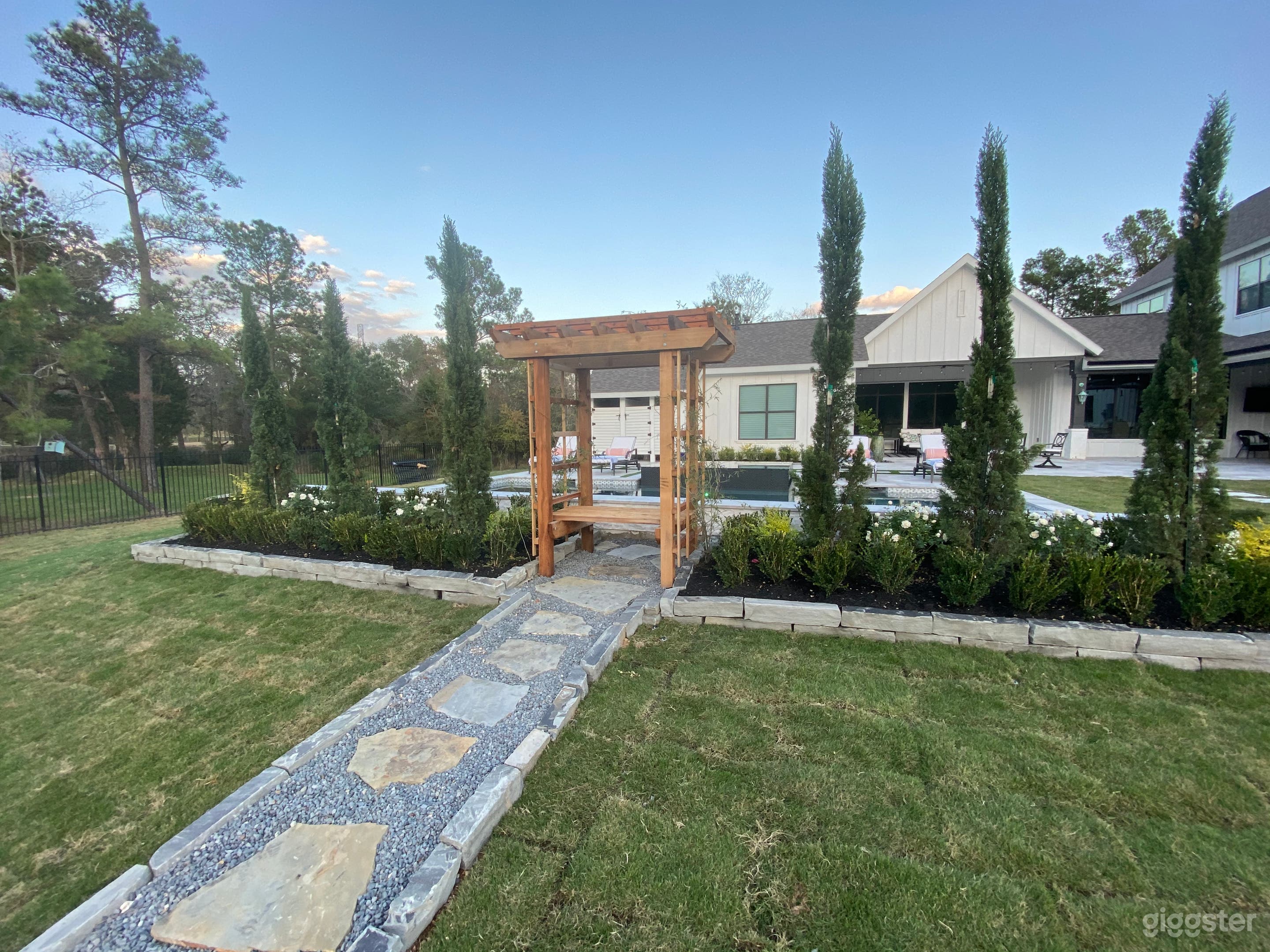 View from behind pool at fireplace seating