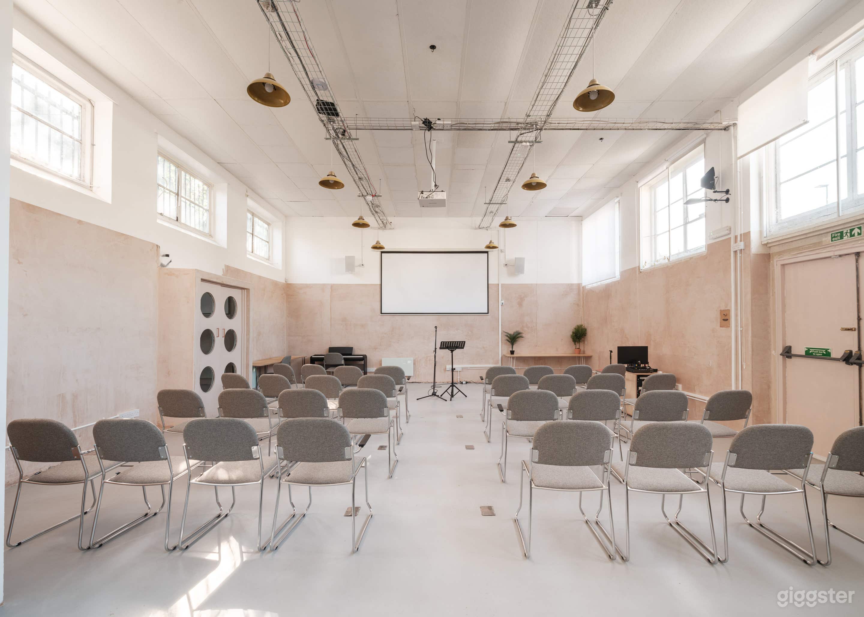 Minimalist, AV-ready Hall for Conferences, Film & Events Photo 1