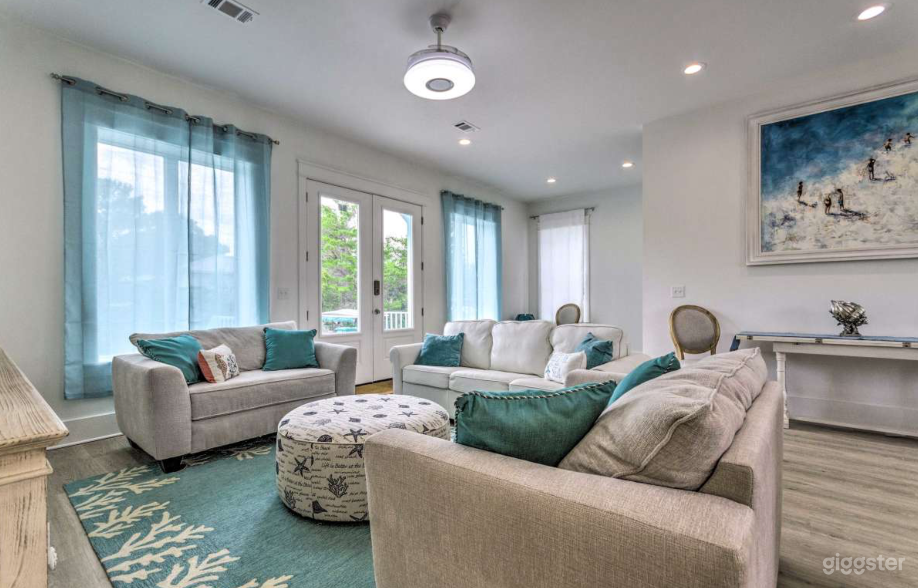 living room with light that turns into fan and plays music