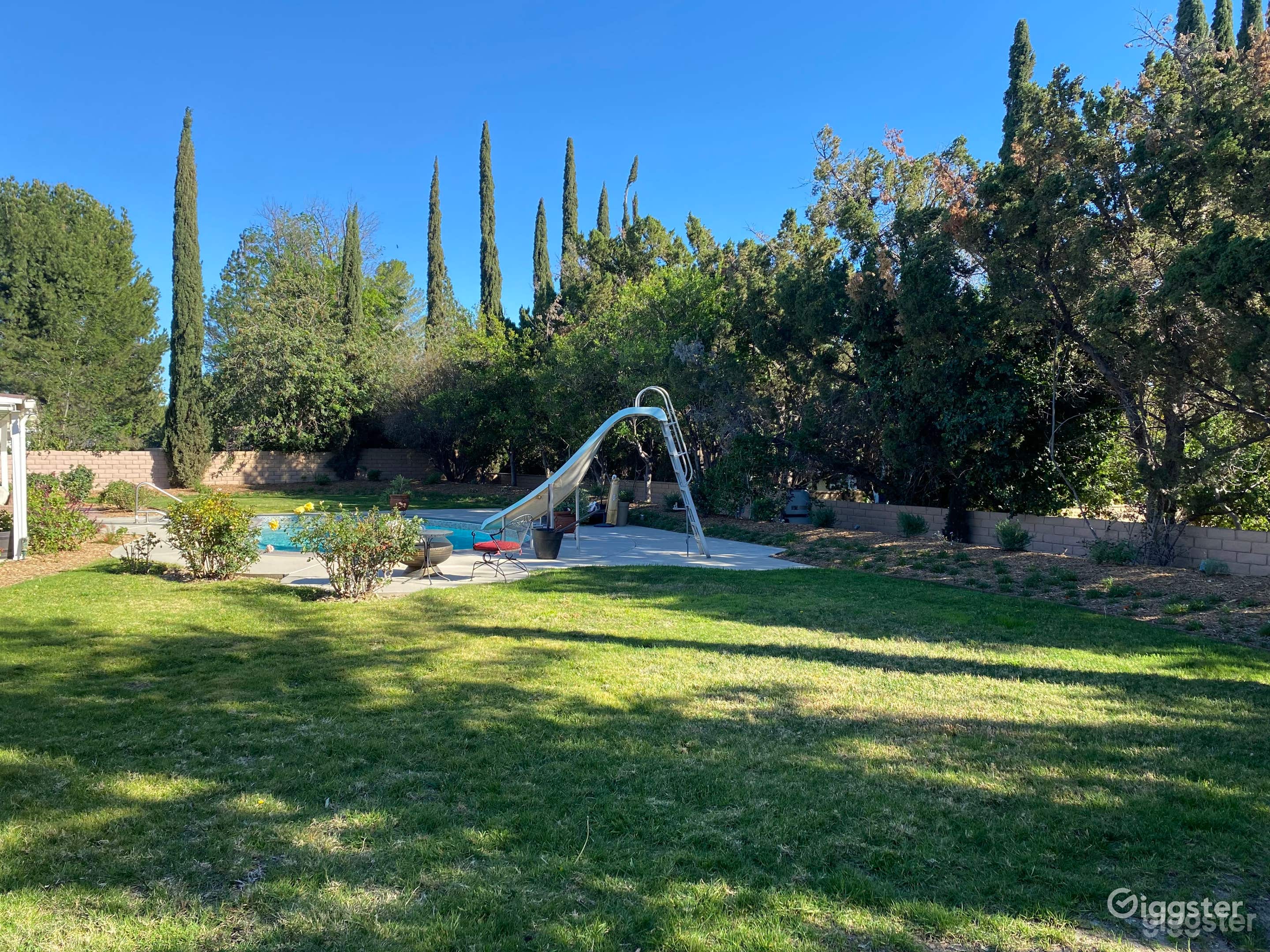 Charming pool complete with a slide and diving board Photo 4