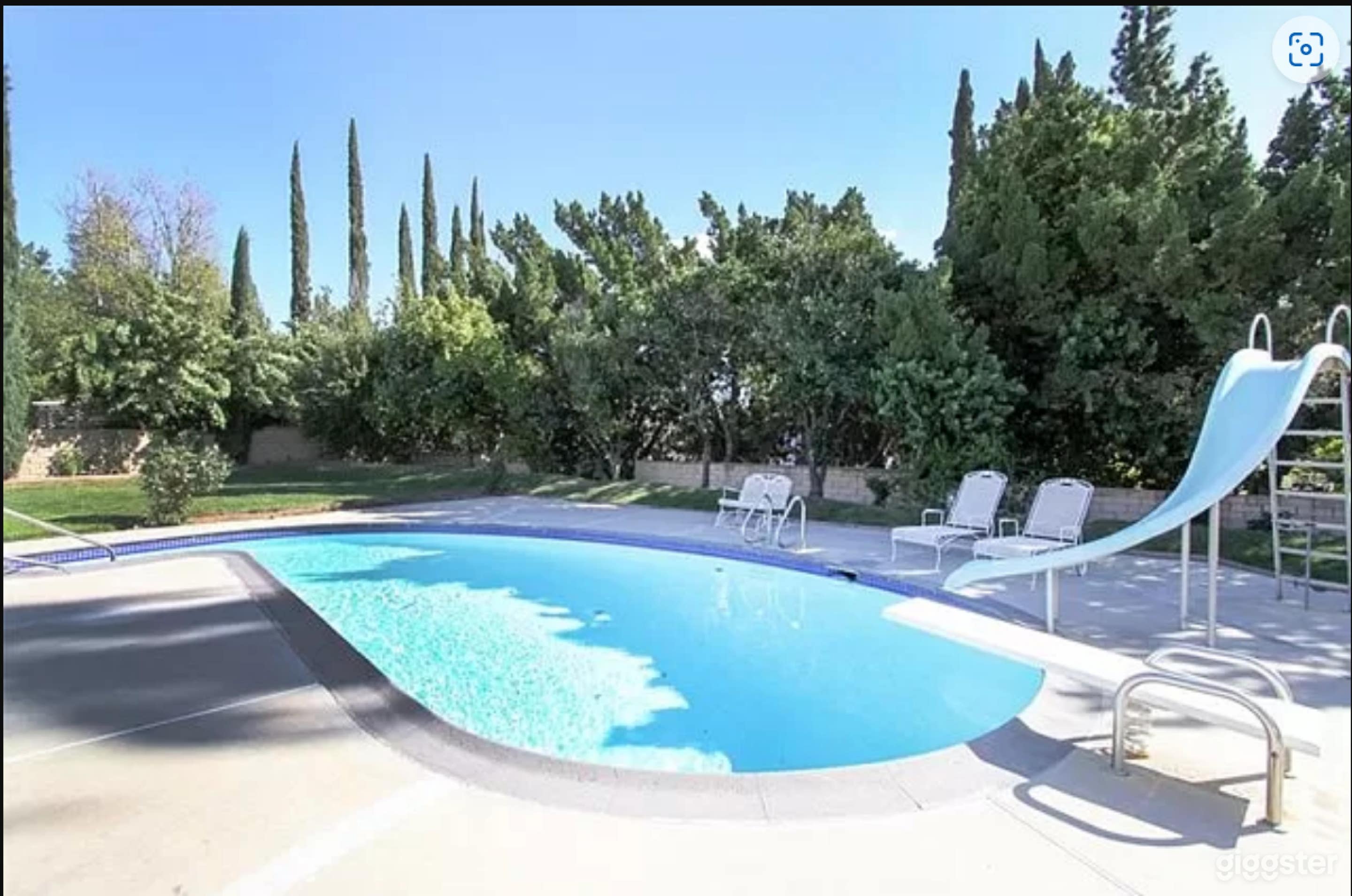 Charming pool complete with a slide and diving board Photo 2