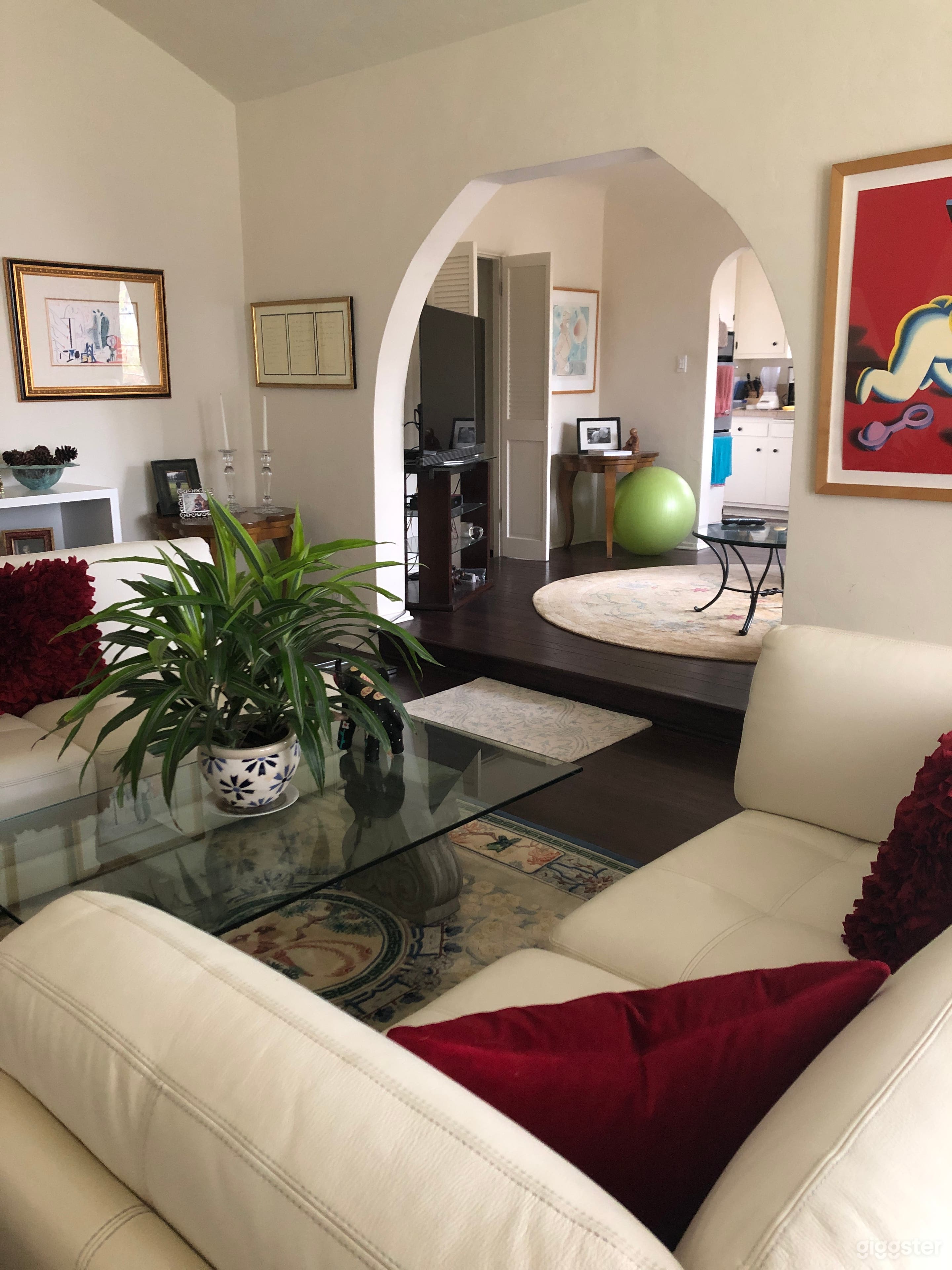 Opposite view from "cover image" to left.  There is a step up to the second living/dining area, below.  Beautiful arches complement this home. 