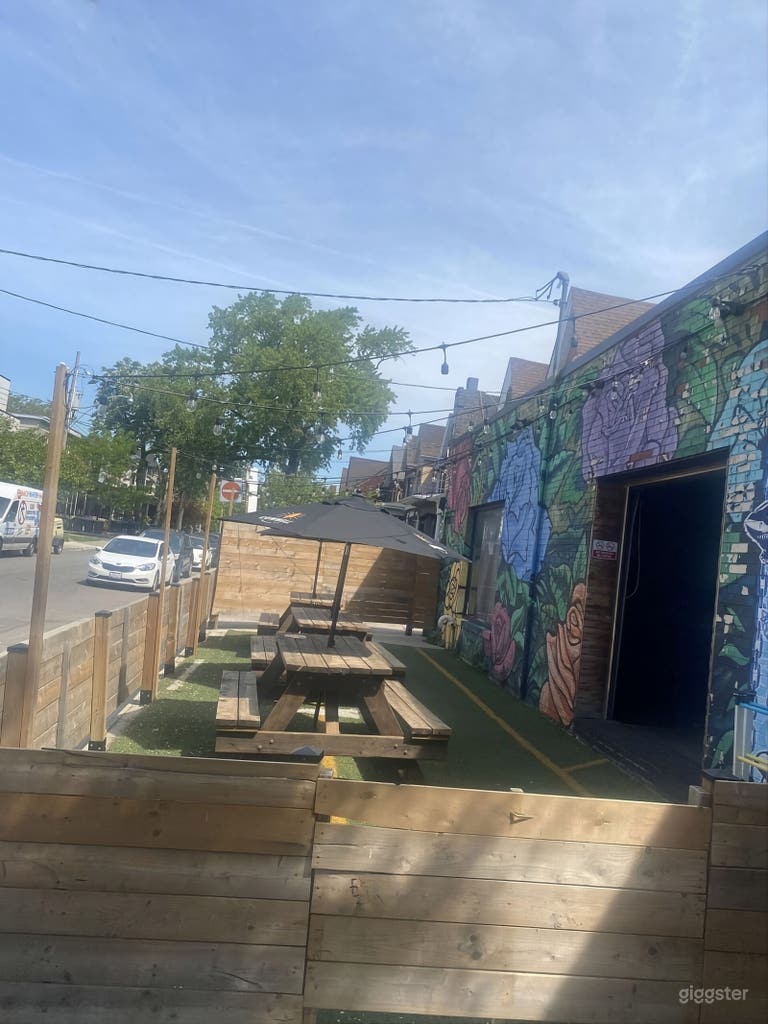 Versatile Brick-Wall Bar & Patio Event Space with Umbrellas 