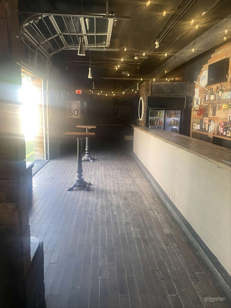  Versatile Brick-Wall Bar & Patio Event Space with Umbrellas 