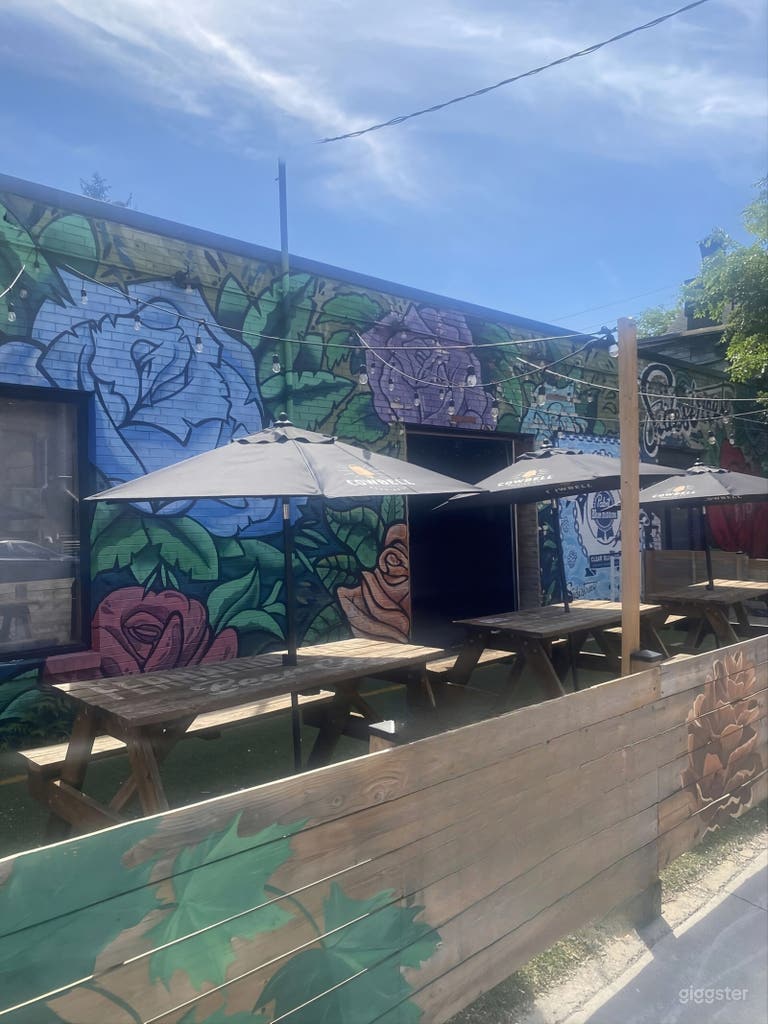  Versatile Brick-Wall Bar & Patio Event Space with Umbrellas 