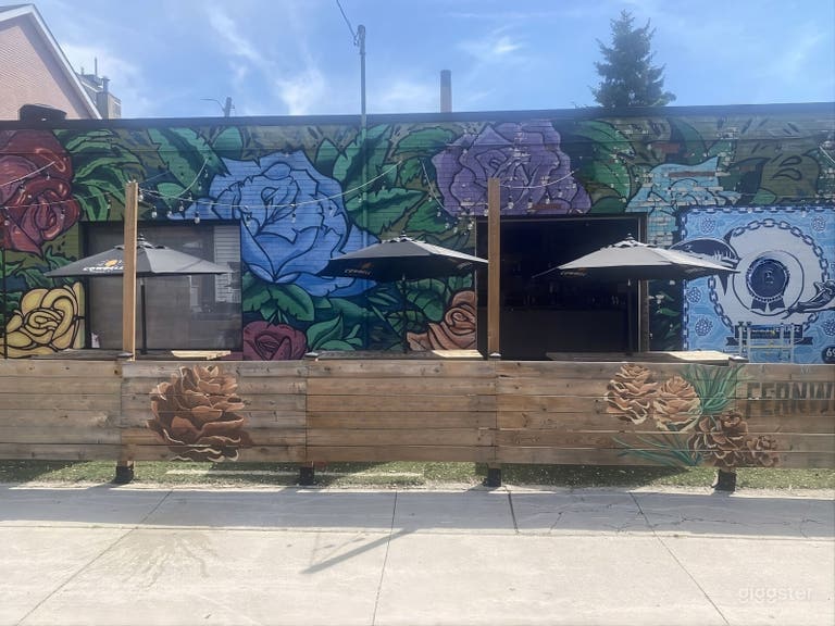  Versatile Brick-Wall Bar & Patio Event Space with Umbrellas 