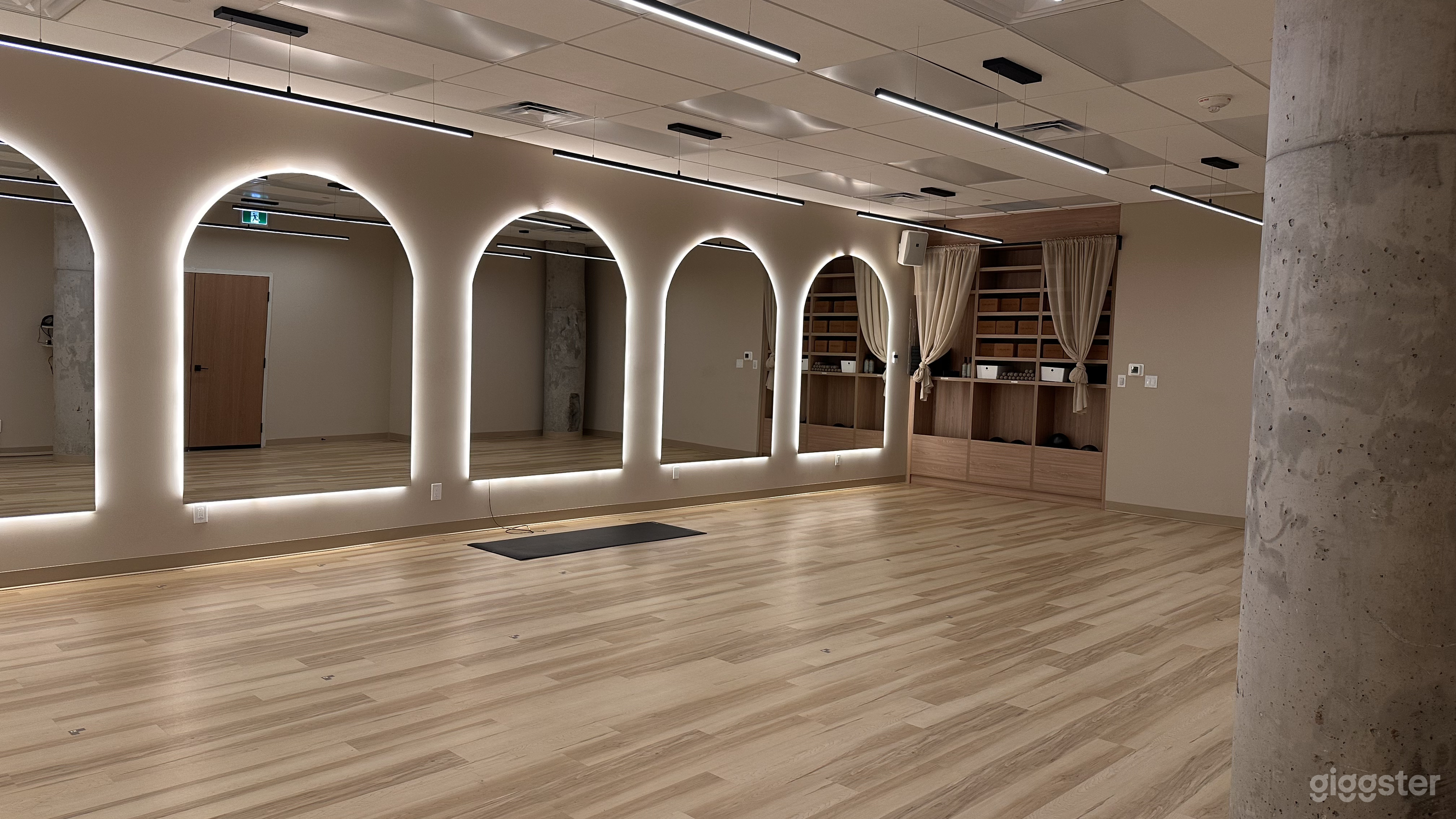 Boutique Modern Studio with Arch Mirror Wall Photo 2