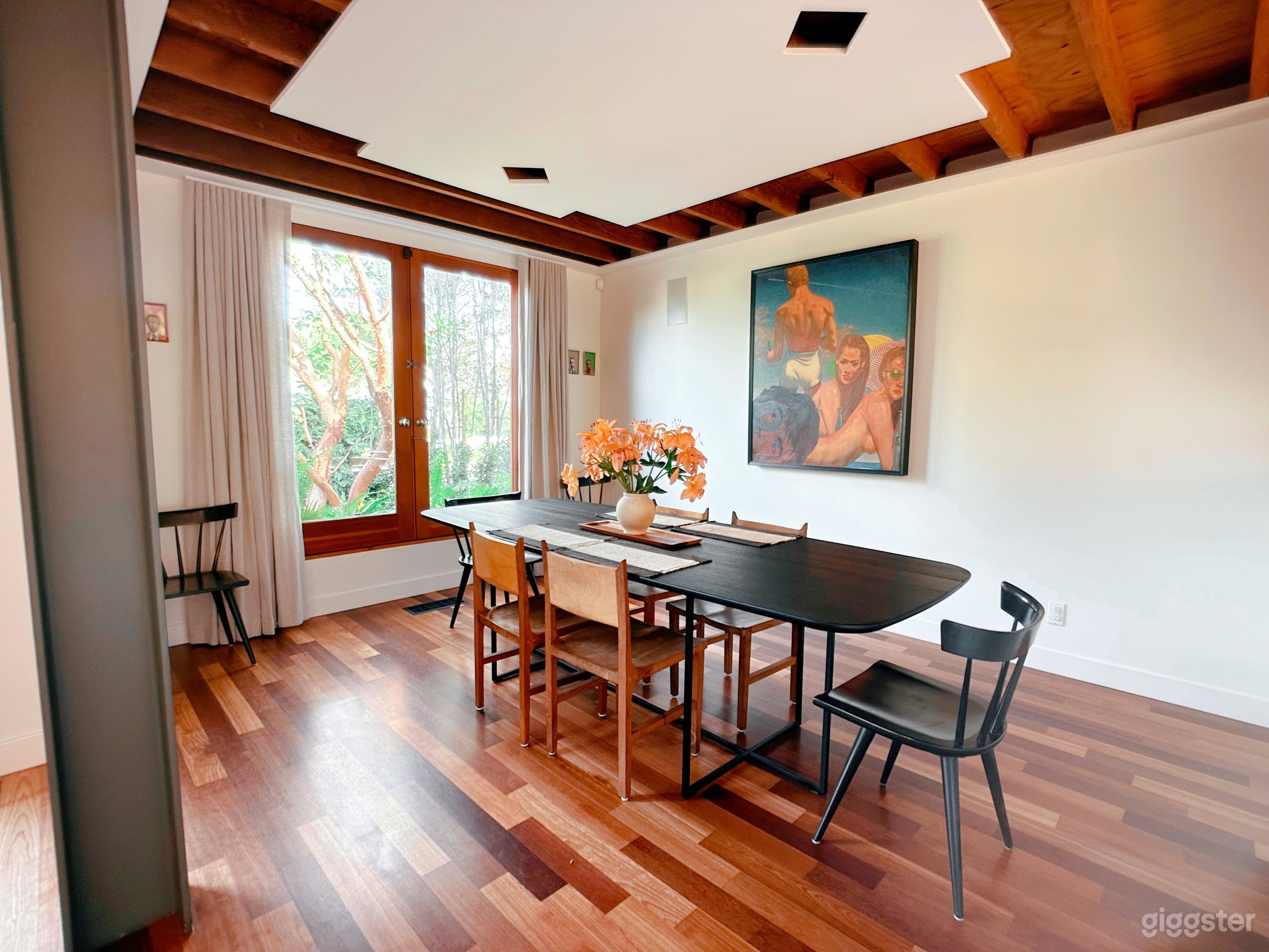 Eclectic, sophisticated dining room with custom drapery.