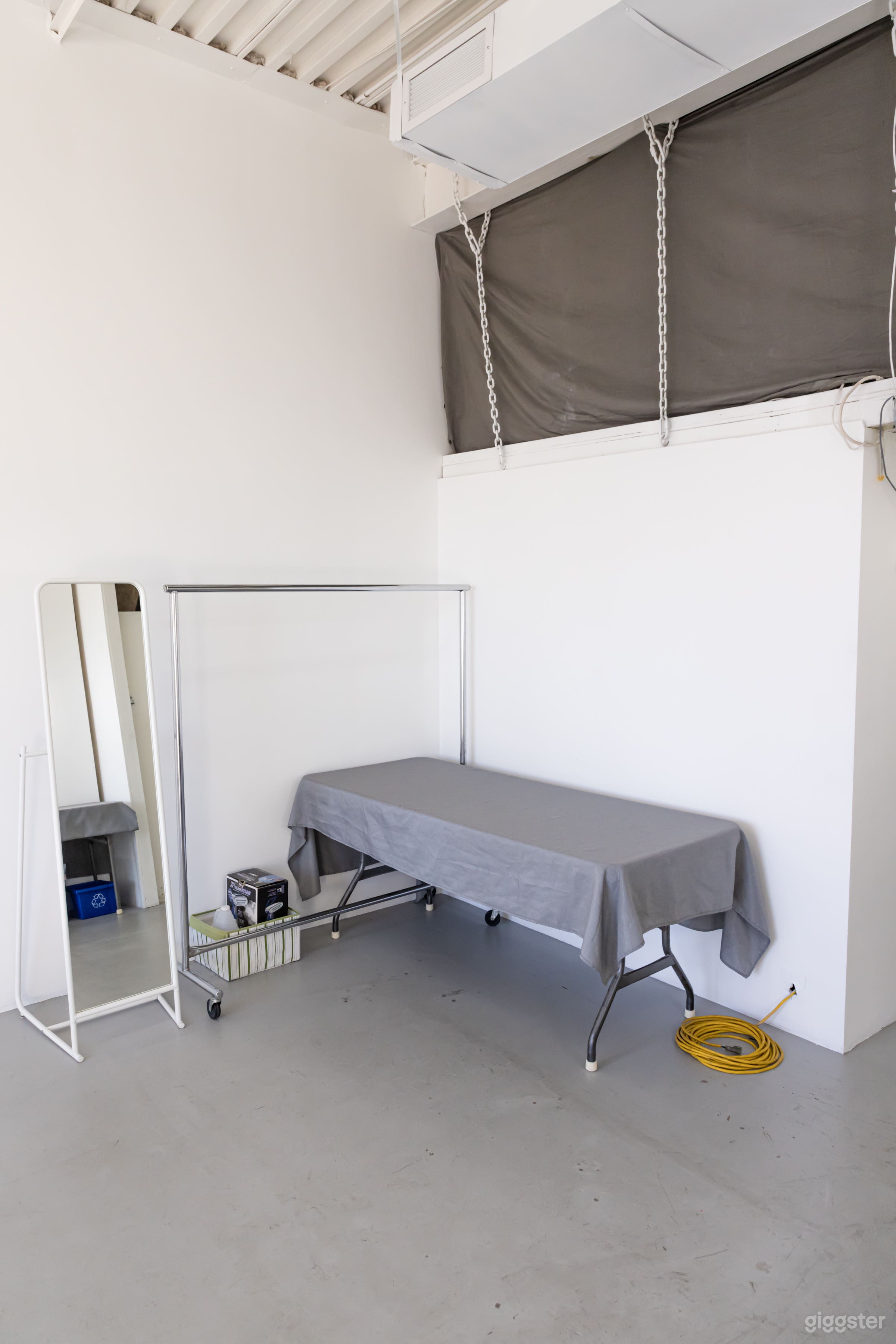 Styling station with full length mirror, 6' table and handheld clothes steamer.