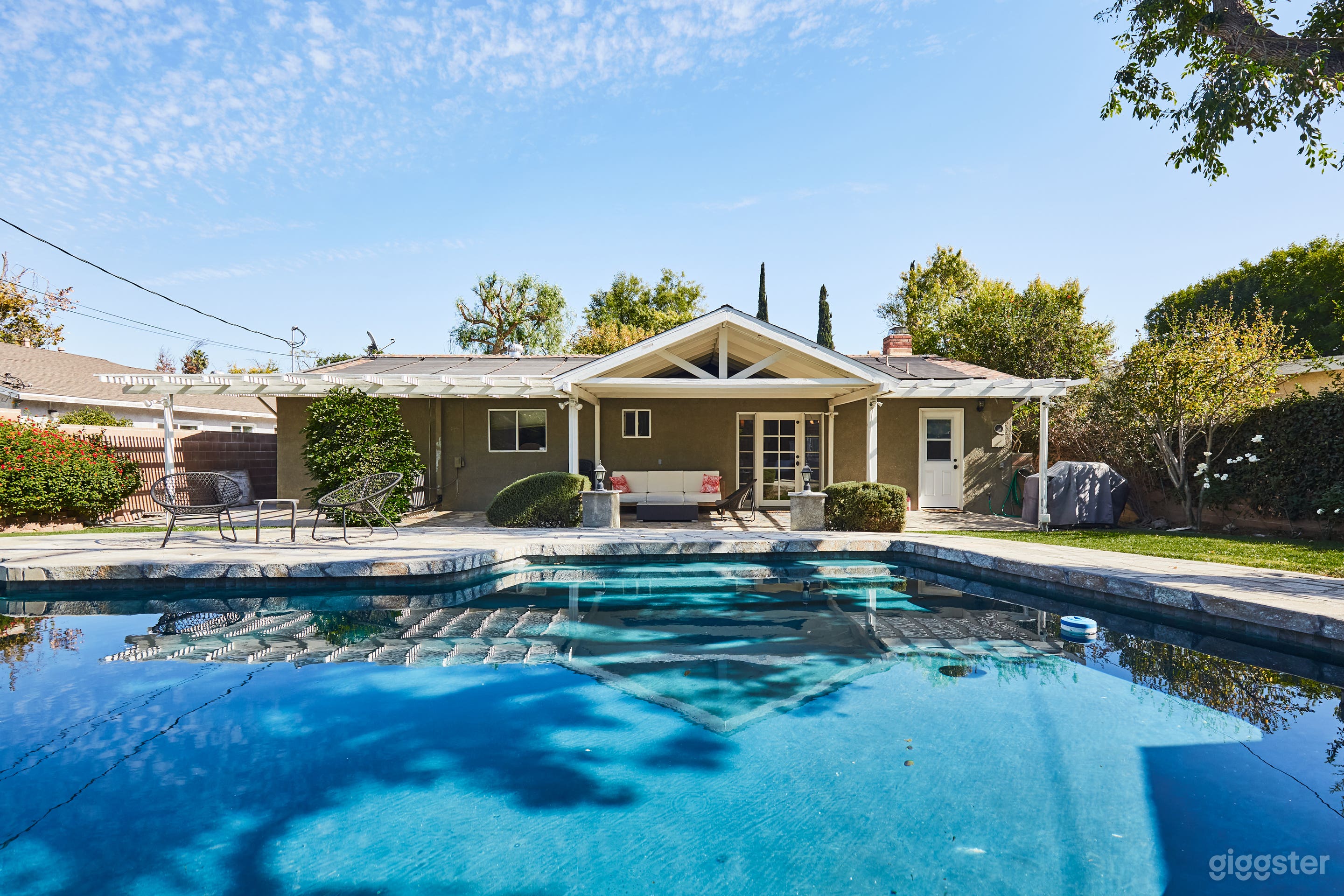 Back of house with pool