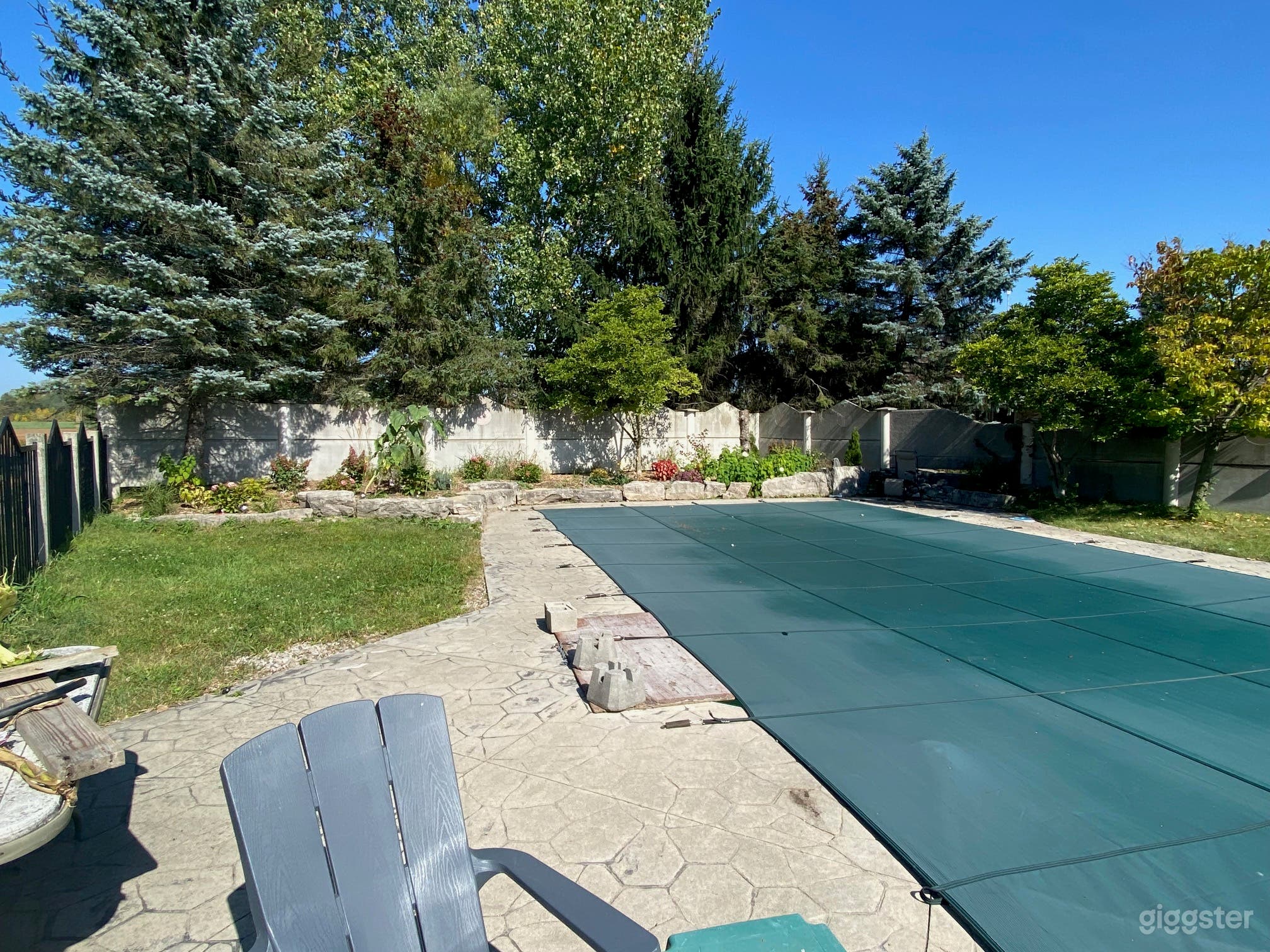 Beautiful pool which is located separate from the house, surrounded by gorgeous landscaping