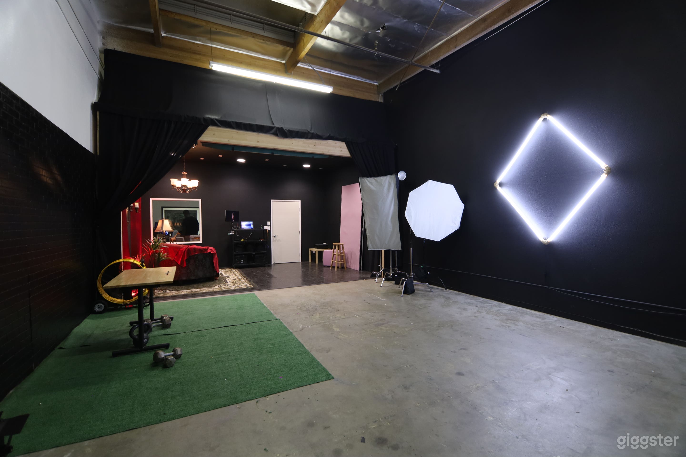 Studio Space - Showcasing Prism Light amongst matte black wall 