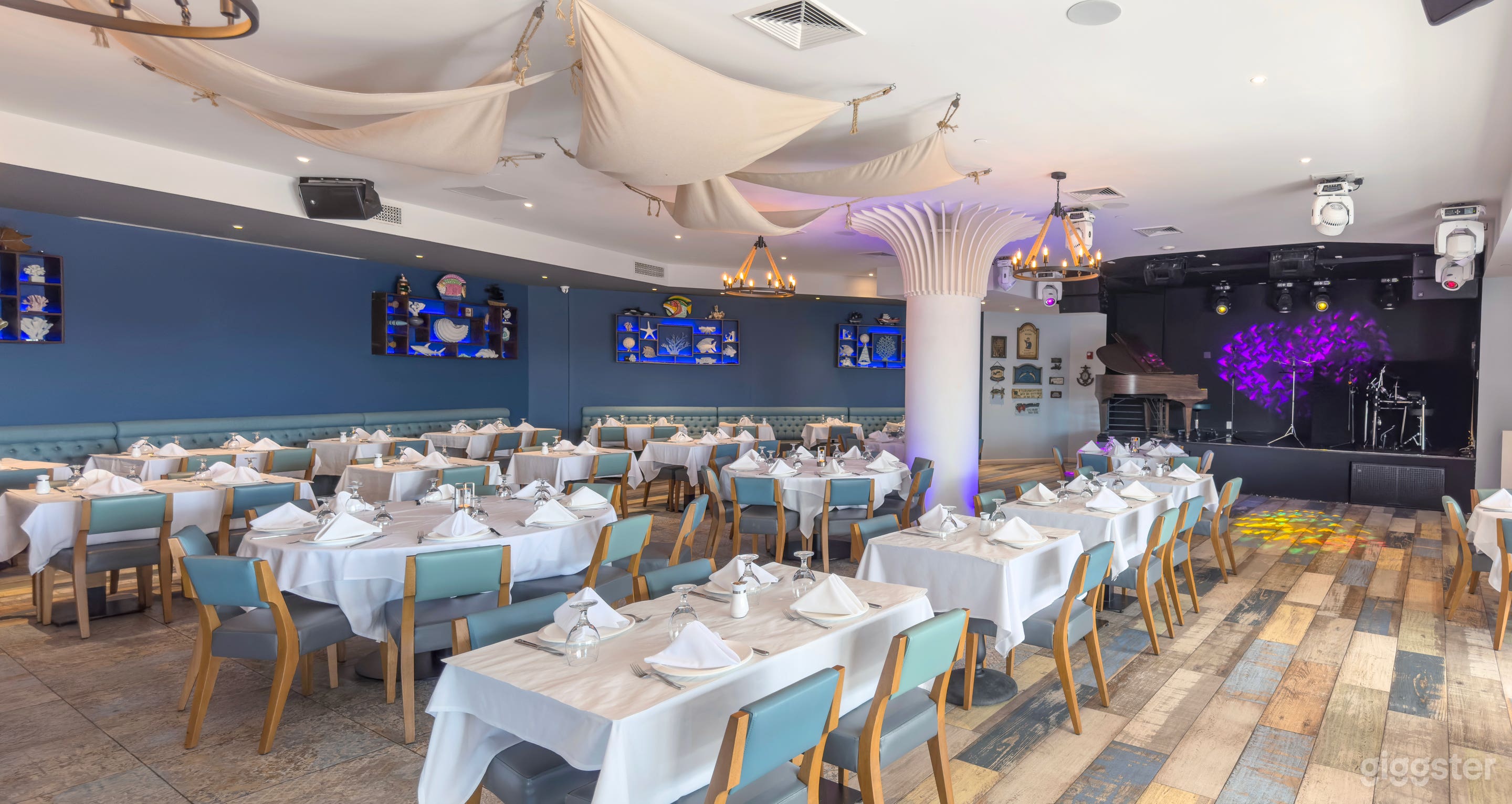 Our nautically themed main dining room's interior, featuring our stage and bar. 120 person capacity.