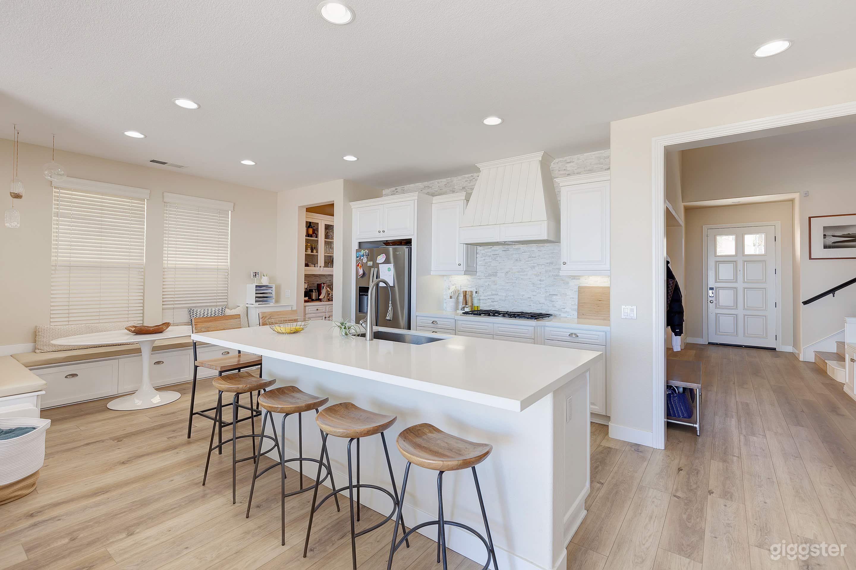 remodeled kitchen with backsplash to ceiling over gas range top