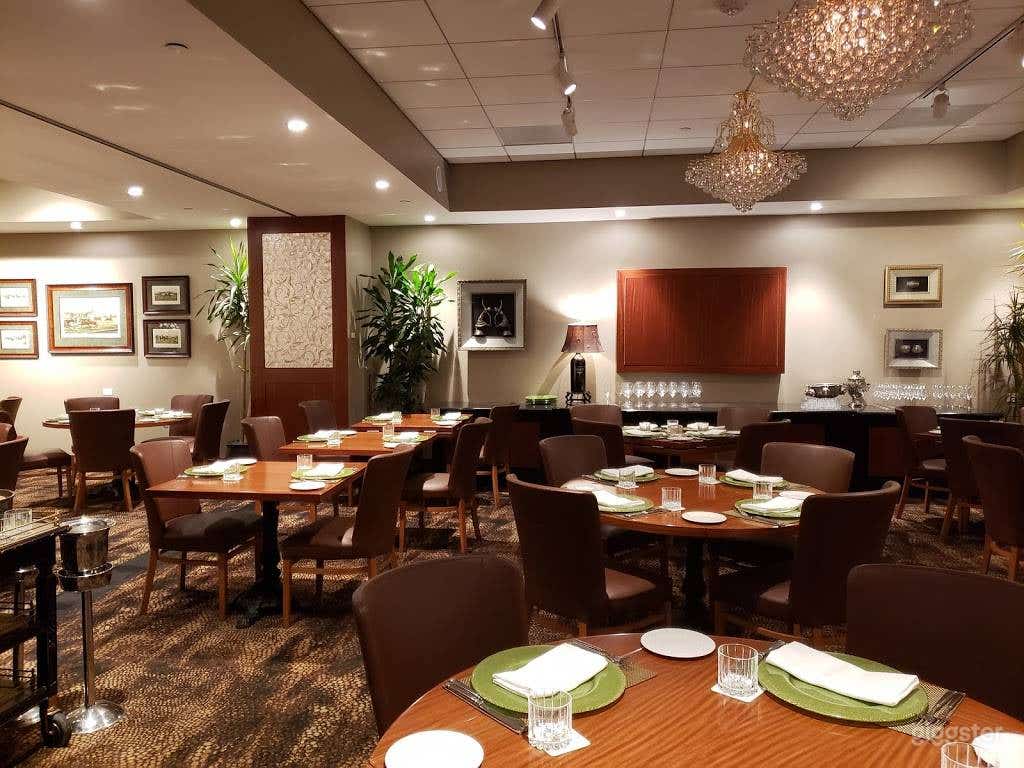 Cozy Dining Room with Polo-themed Paintings in Houston Photo 1