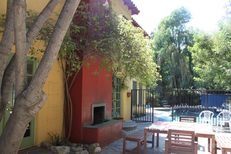  Back stone patio with pool, Mexican tile fireplace- this is a beautiful and excellent space 