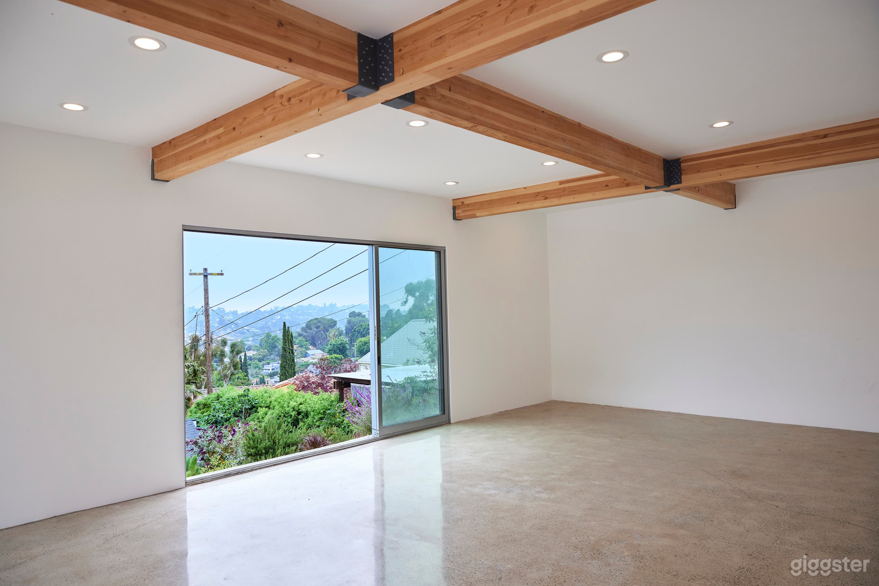 Airy Industrial Polished Concrete +WoodBeam Studio Photo 1