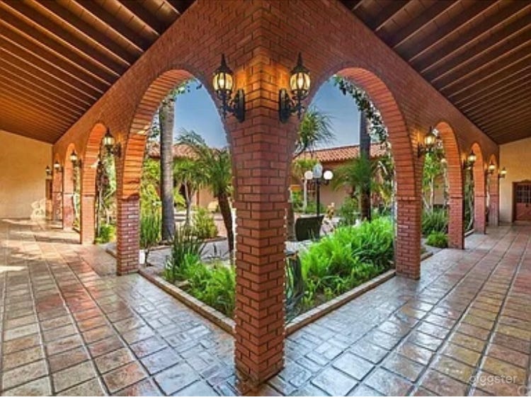 Spanish Style Tropical Courtyard  Photo 1