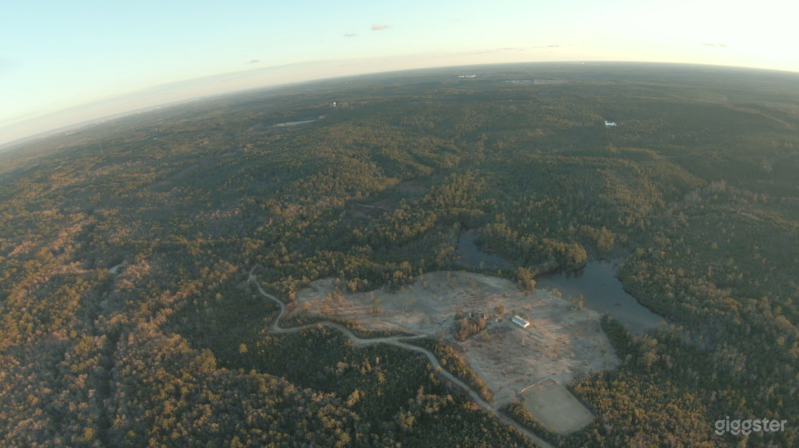 Drone view of arena, pasture and pond