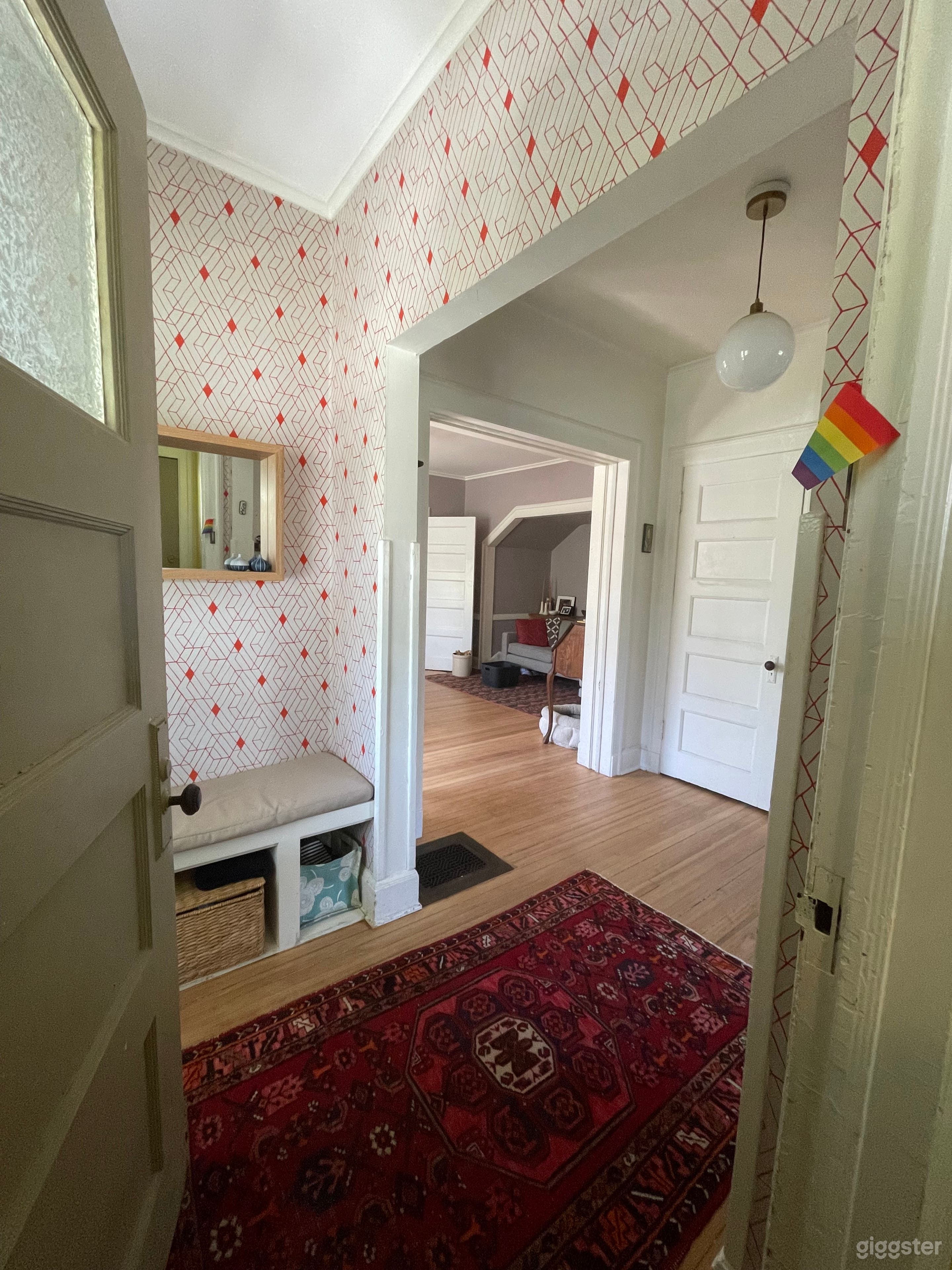 Opening the second door in the foyer to Heath designed wallpaper.