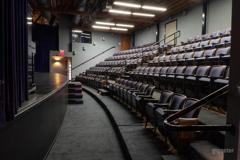  150 seat theater.  Has installed sound system, projector, and screen installed. 