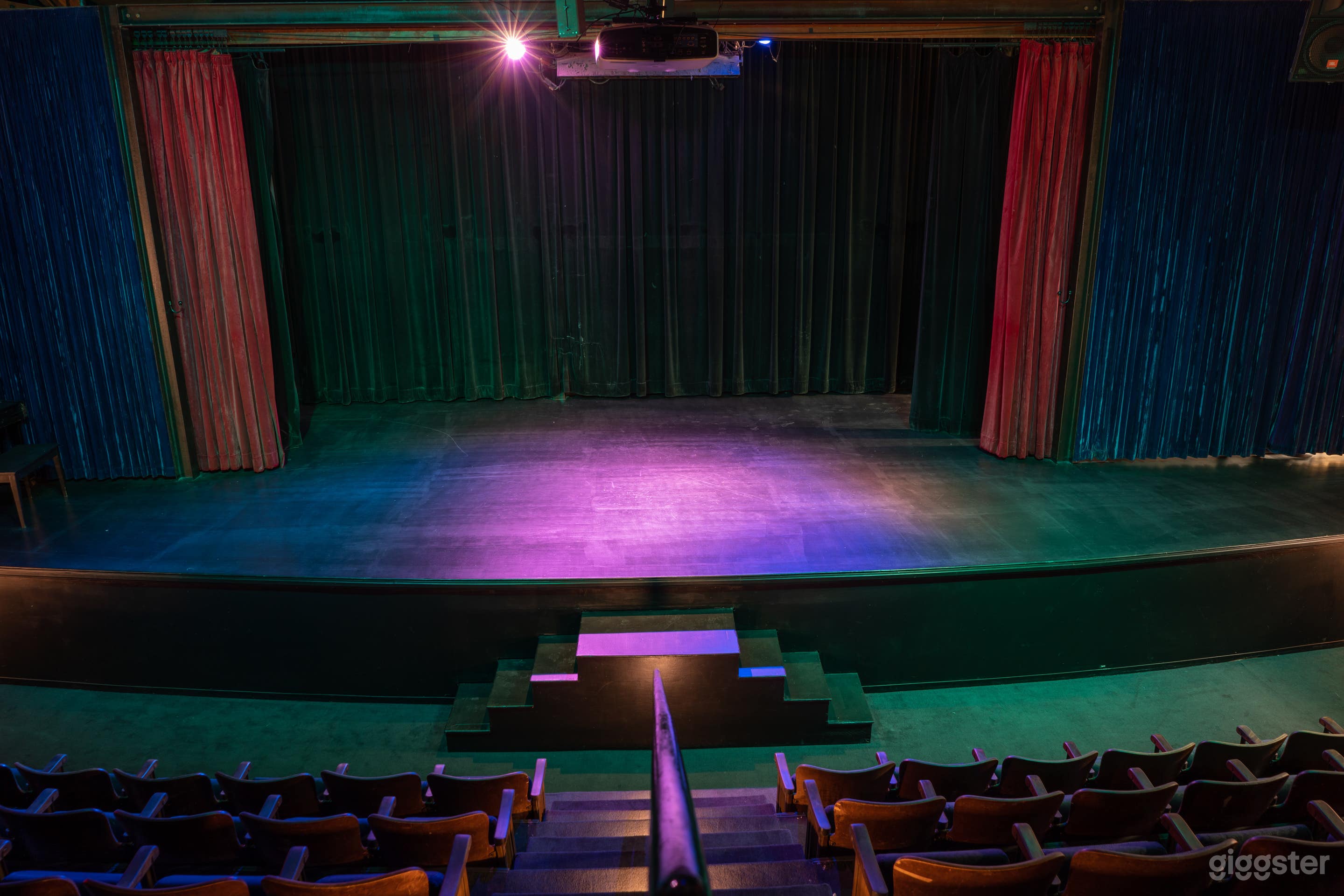 150 seat theater.  Has installed sound system, projector, and screen installed.