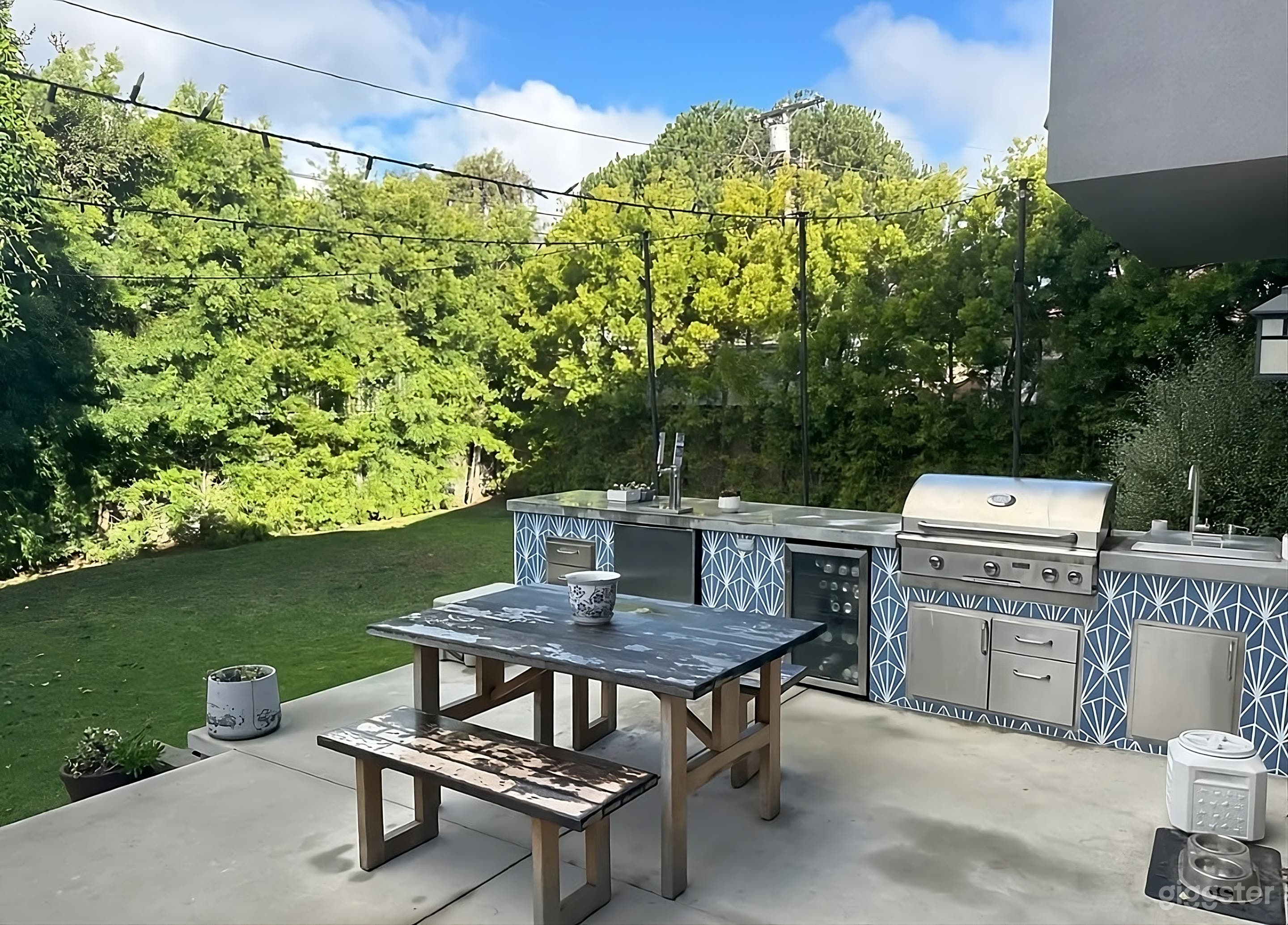 Backyard with Grilling Station and Fire Pit Lounge Photo 1