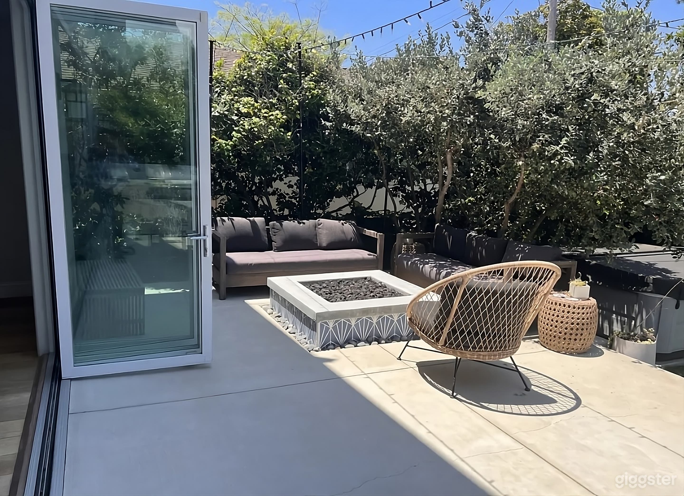 Backyard with Grilling Station and Fire Pit Lounge Photo 4