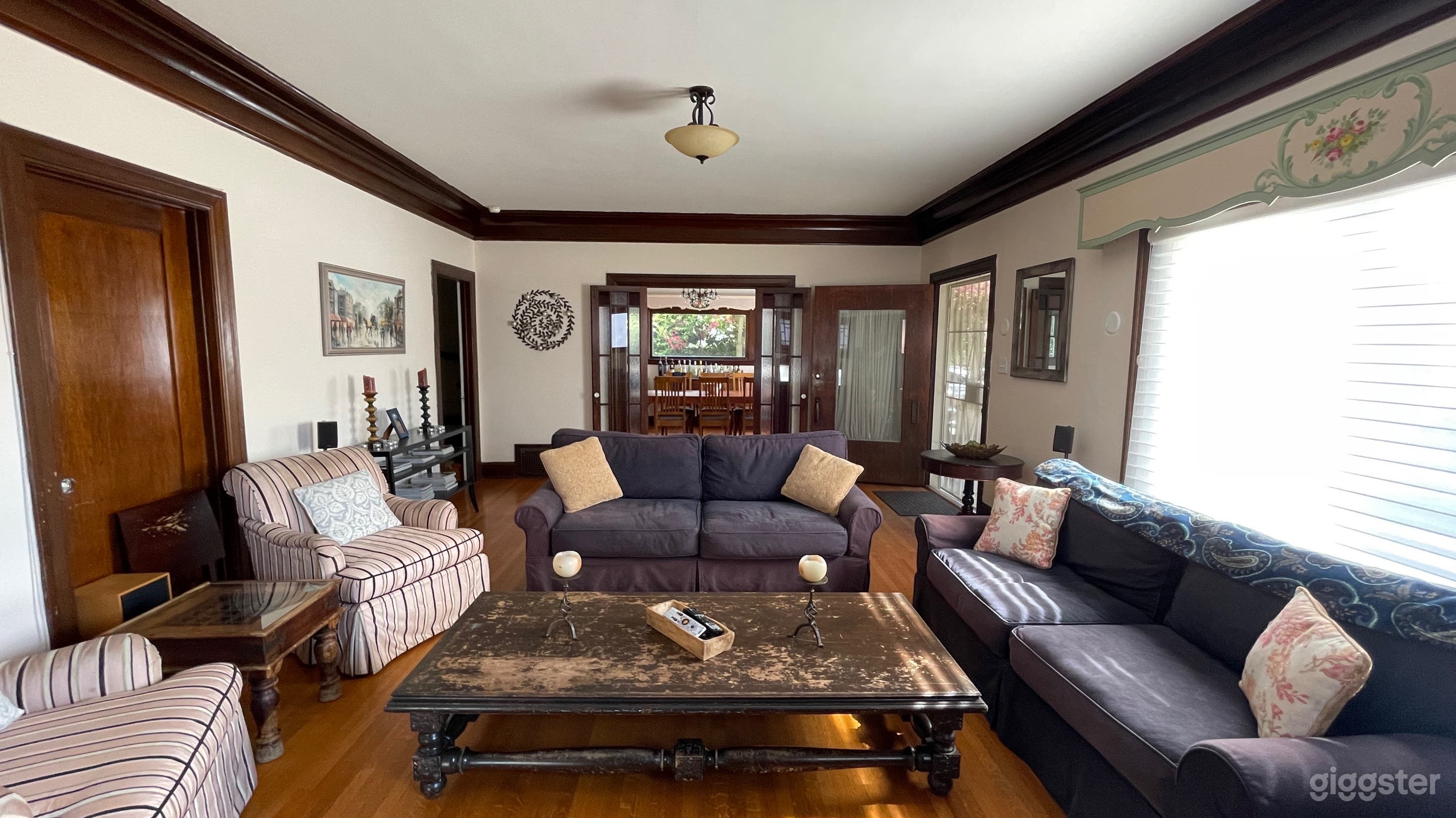 Large living room that looks into dining room.