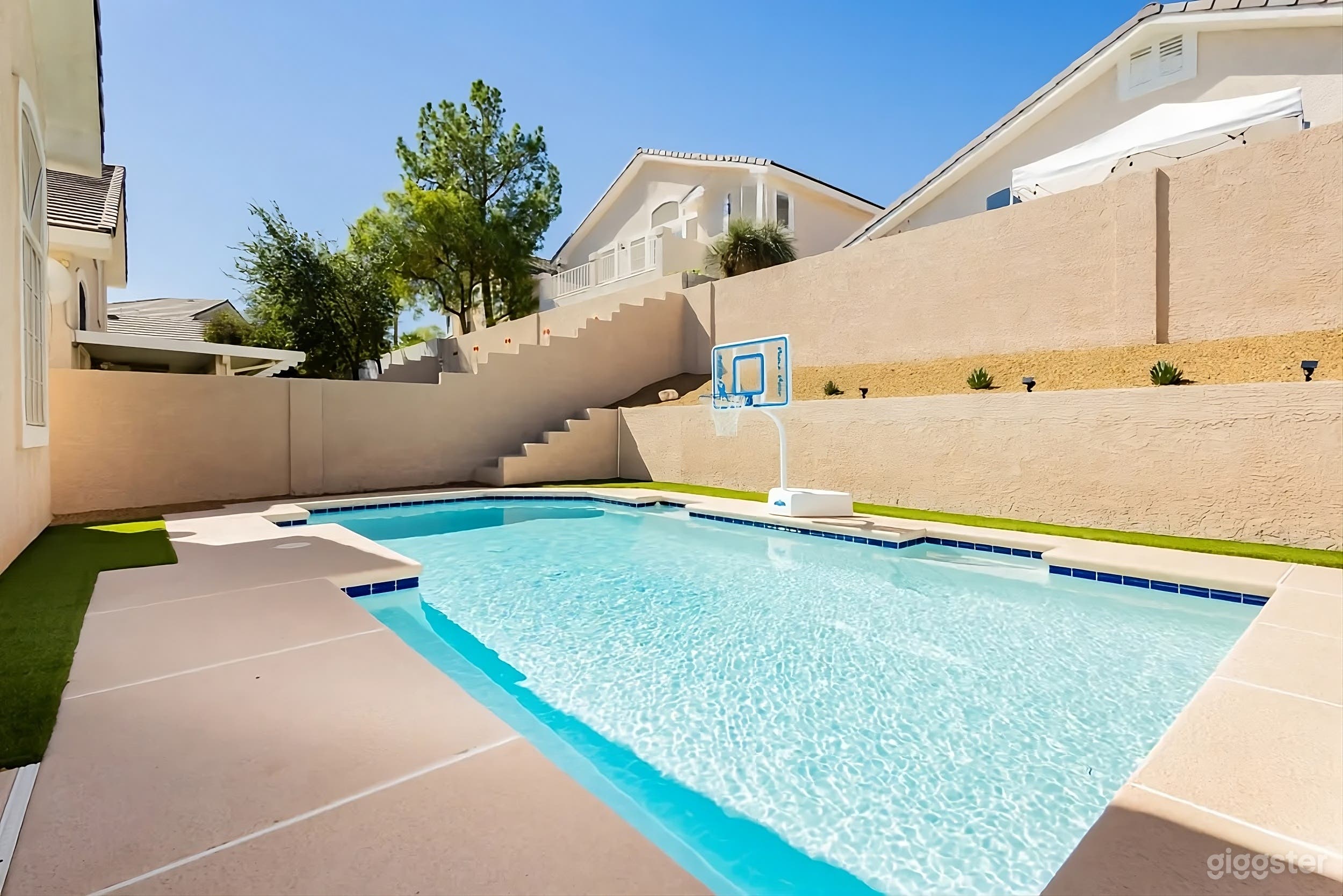 Modern Backyard Poolside Retreat with Patio Lounge Photo 2