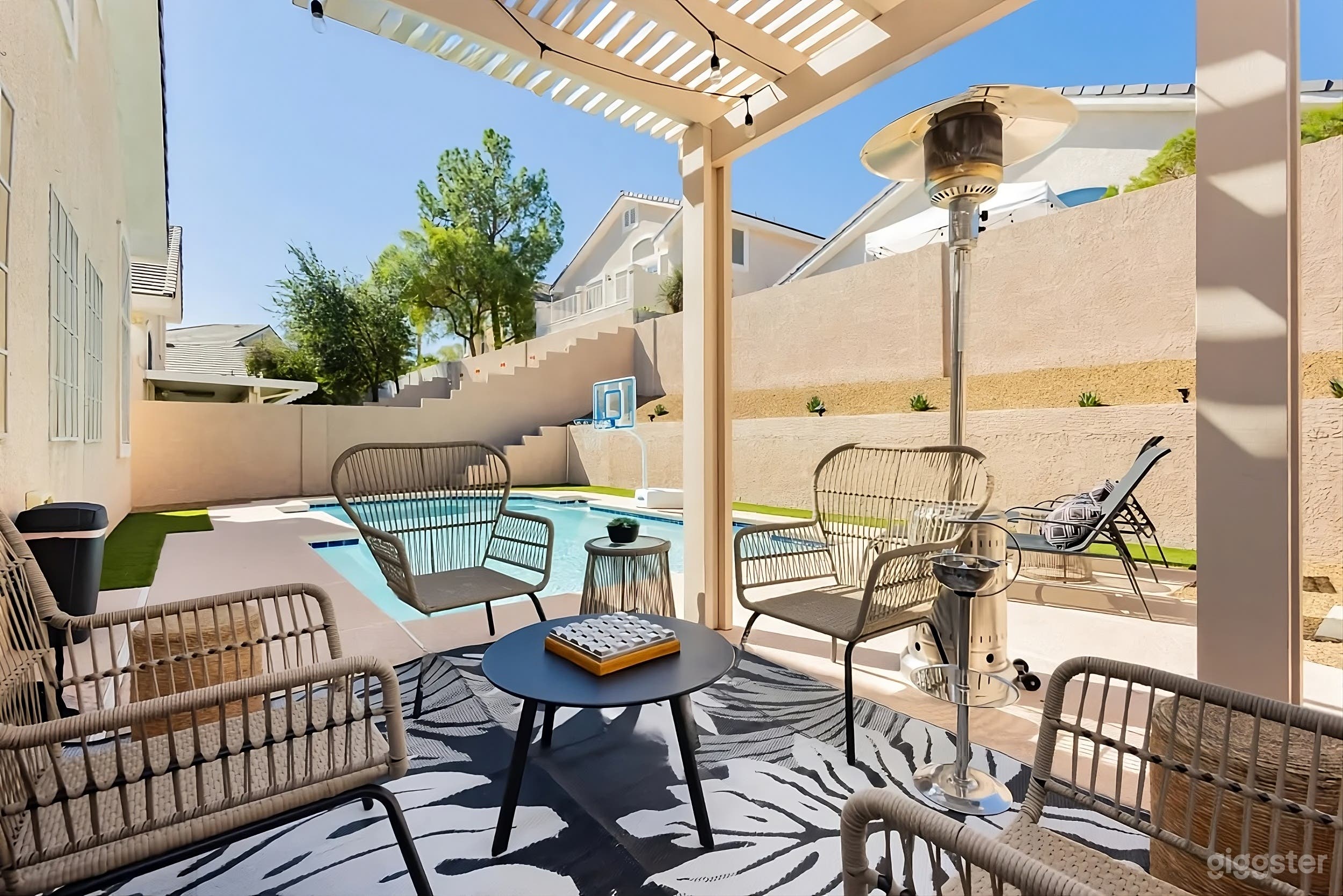 Modern Backyard Poolside Retreat with Patio Lounge Photo 1