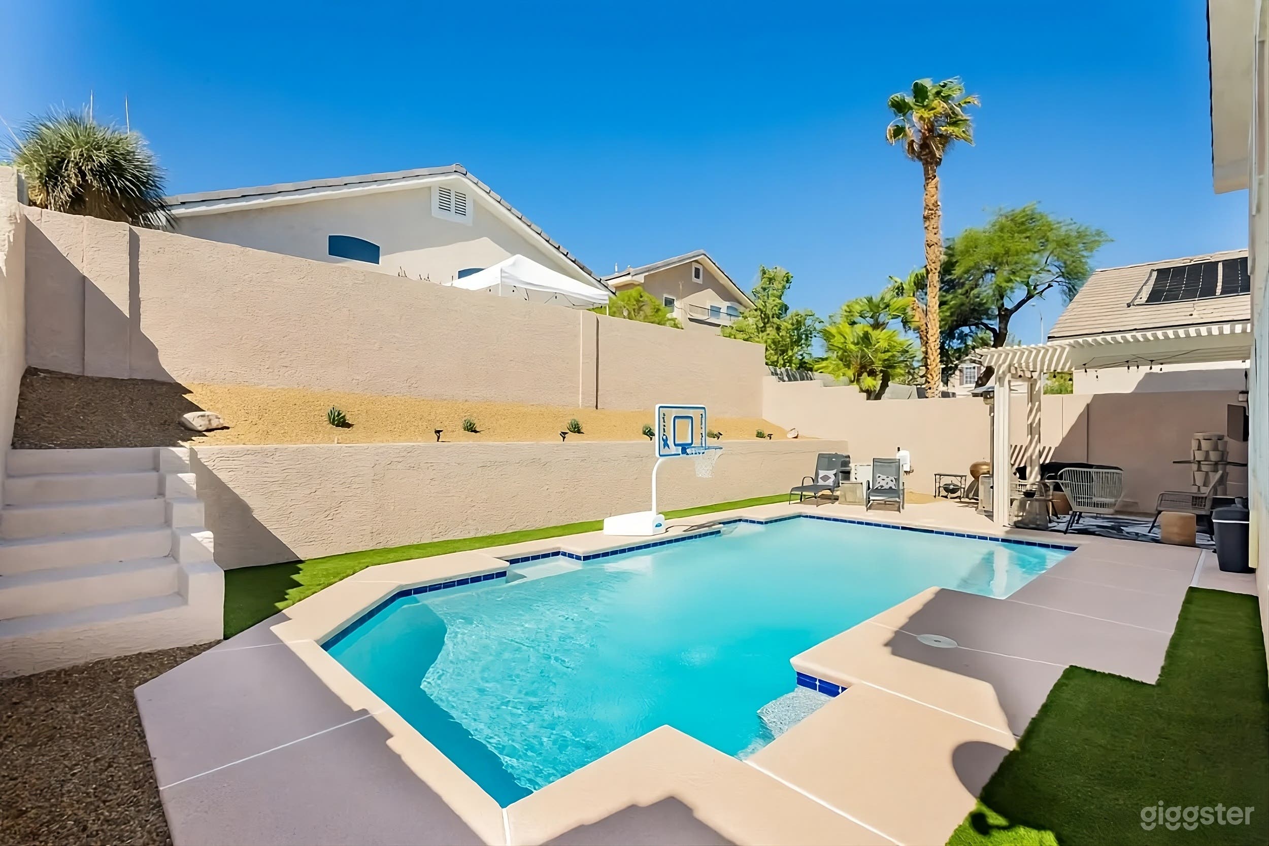 Modern Backyard Poolside Retreat with Patio Lounge Photo 3