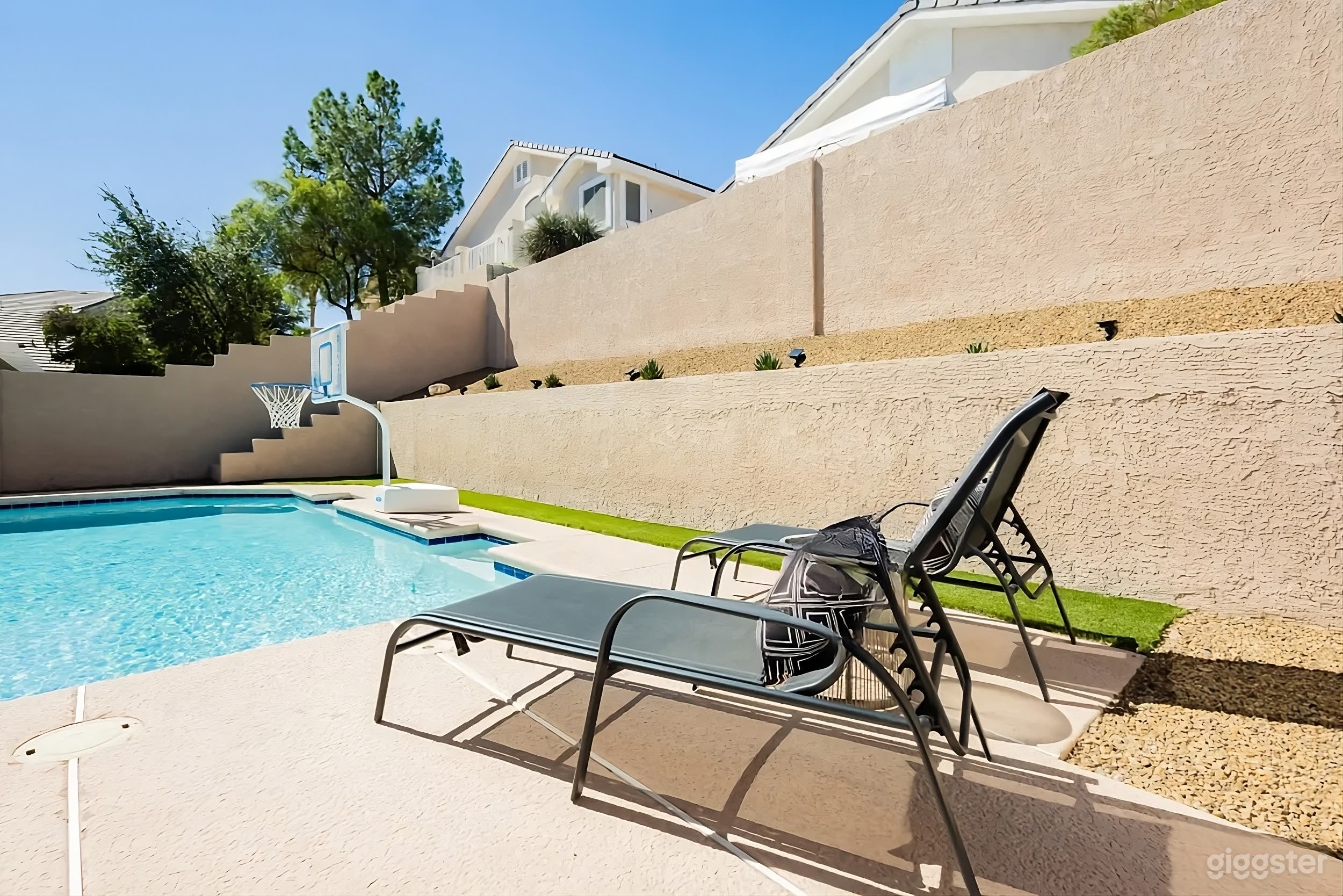 Modern Backyard Poolside Retreat with Patio Lounge Photo 4